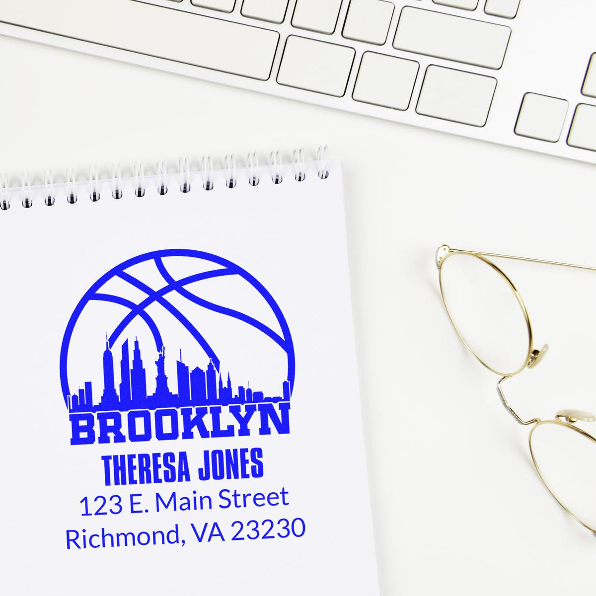 Custom Brooklyn basketball rubber stamp with Theresa Jones address, used on notebook for personalized stationery.
