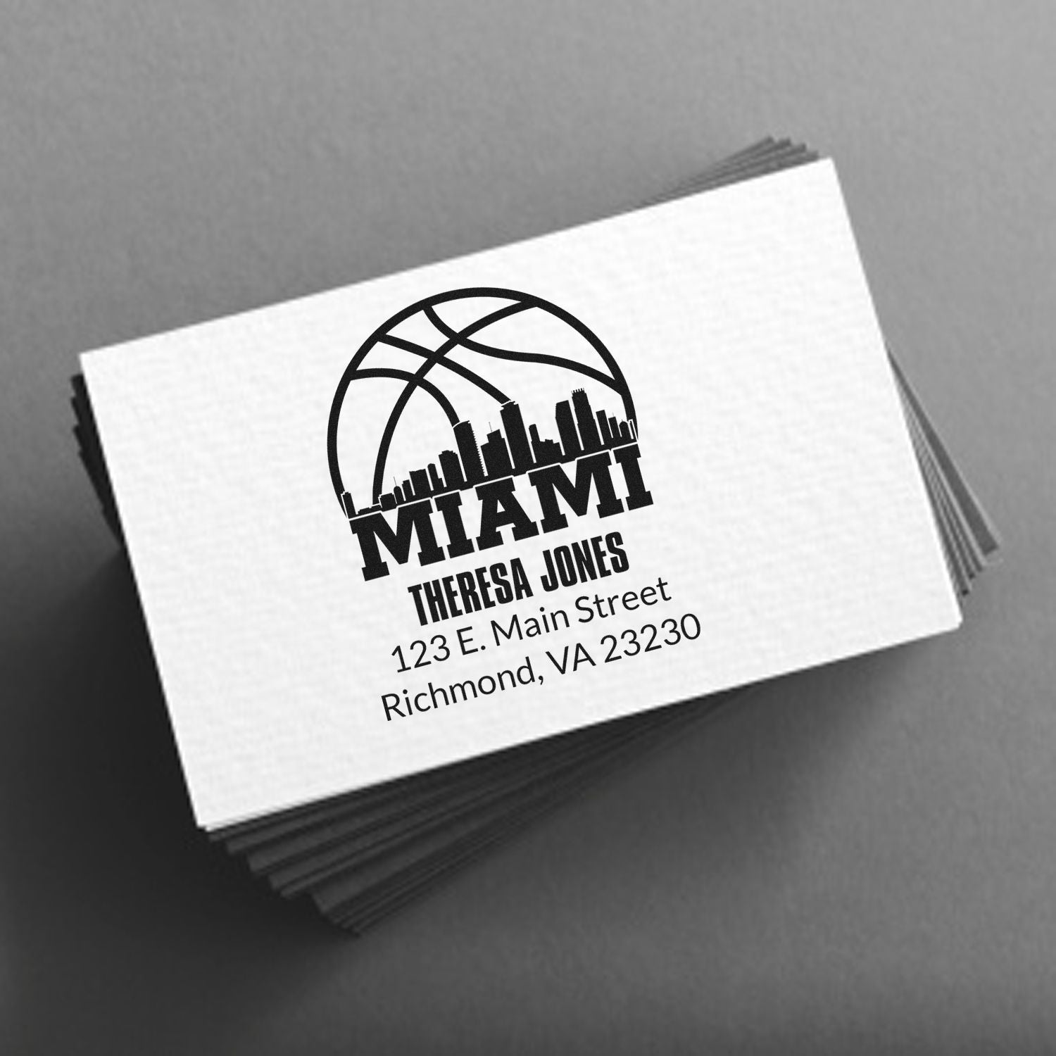Custom Miami rubber stamp with basketball logo and Theresa Jones address for personalized business stationery.