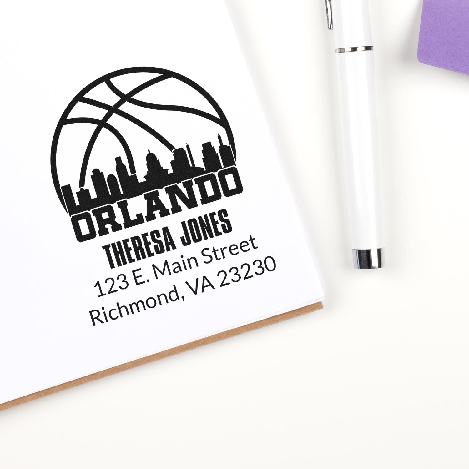 Custom Orlando address rubber stamp design with skyline logo, Theresa Jones name, and mailing address for stationery.