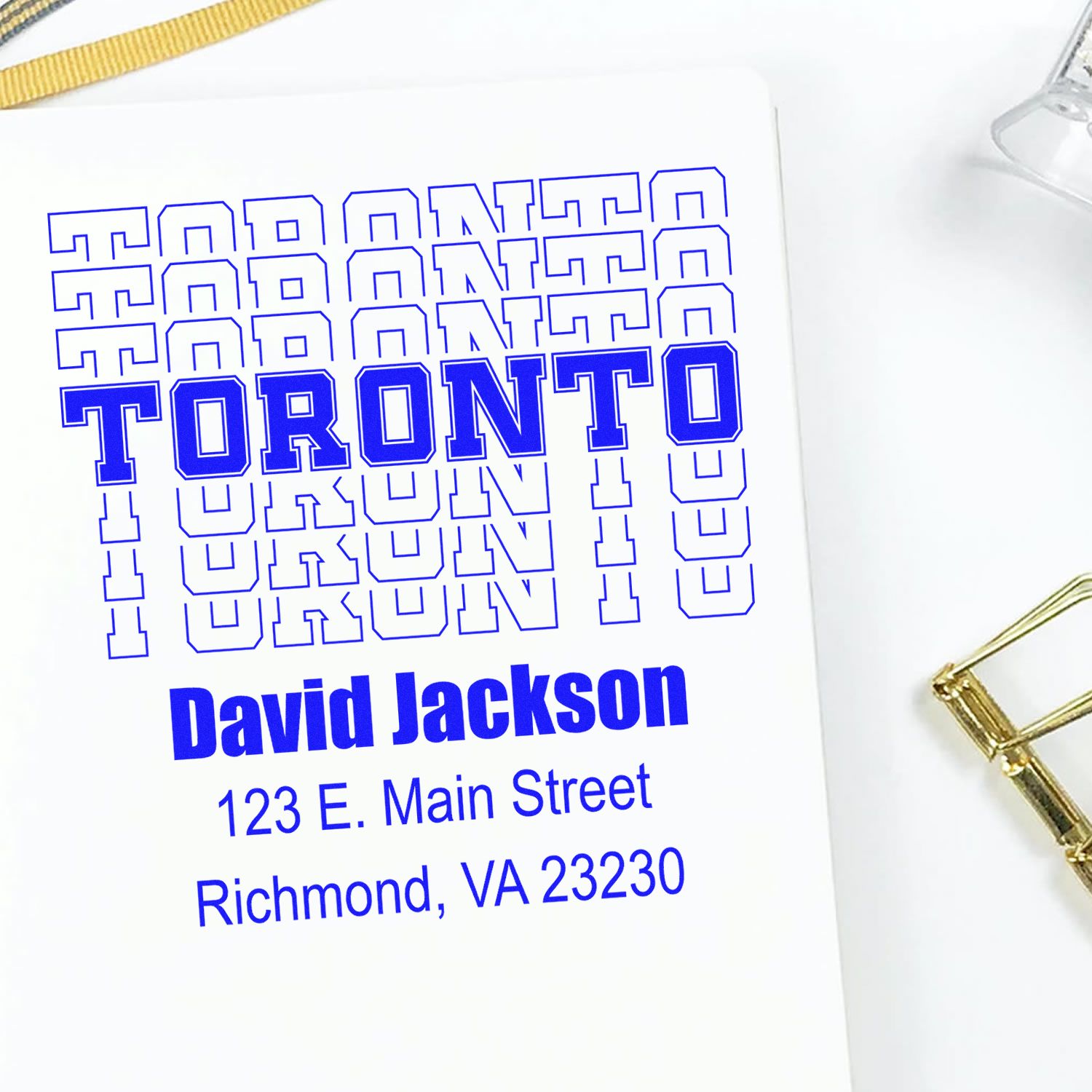 Custom Toronto address rubber stamp design with name and mailing address for personalized stationery and labels.