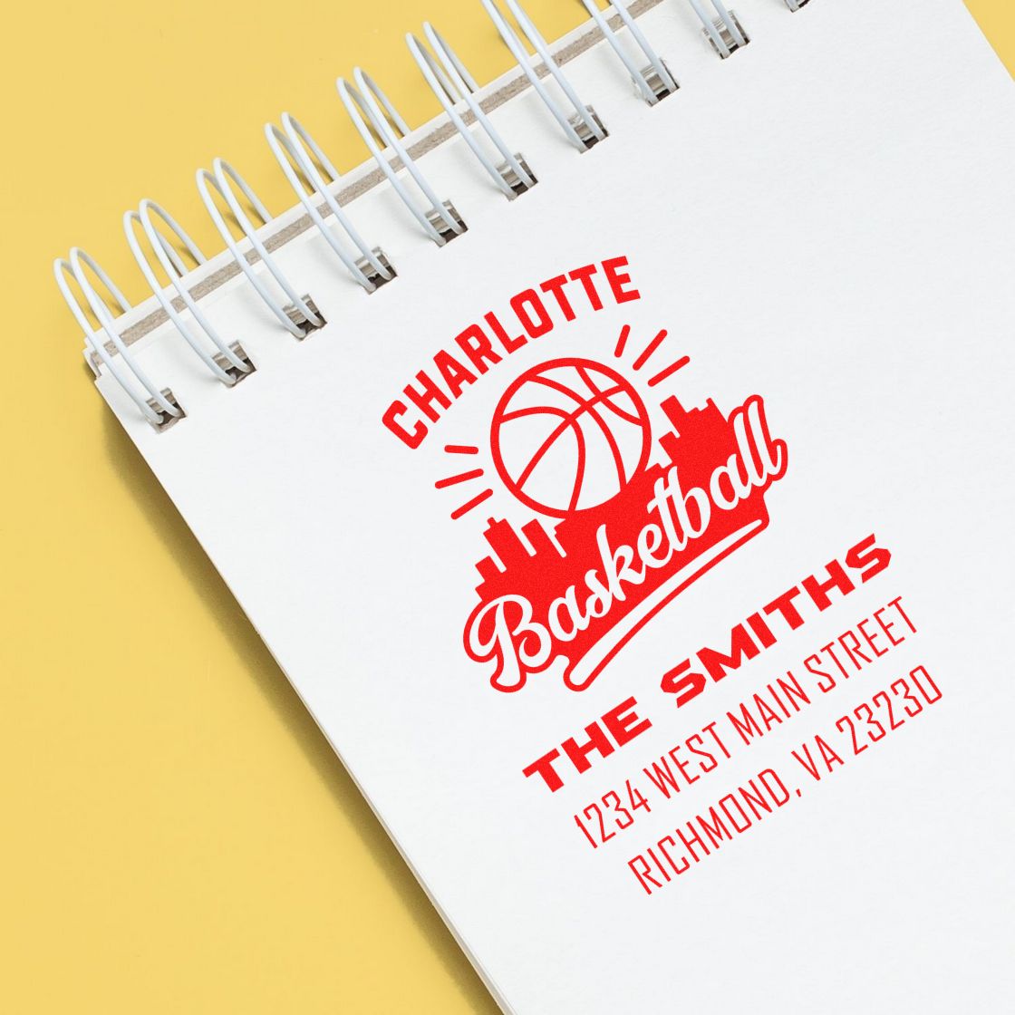 Personalized rubber stamp design for Charlotte basketball and The Smiths, featuring logo, name, and address.