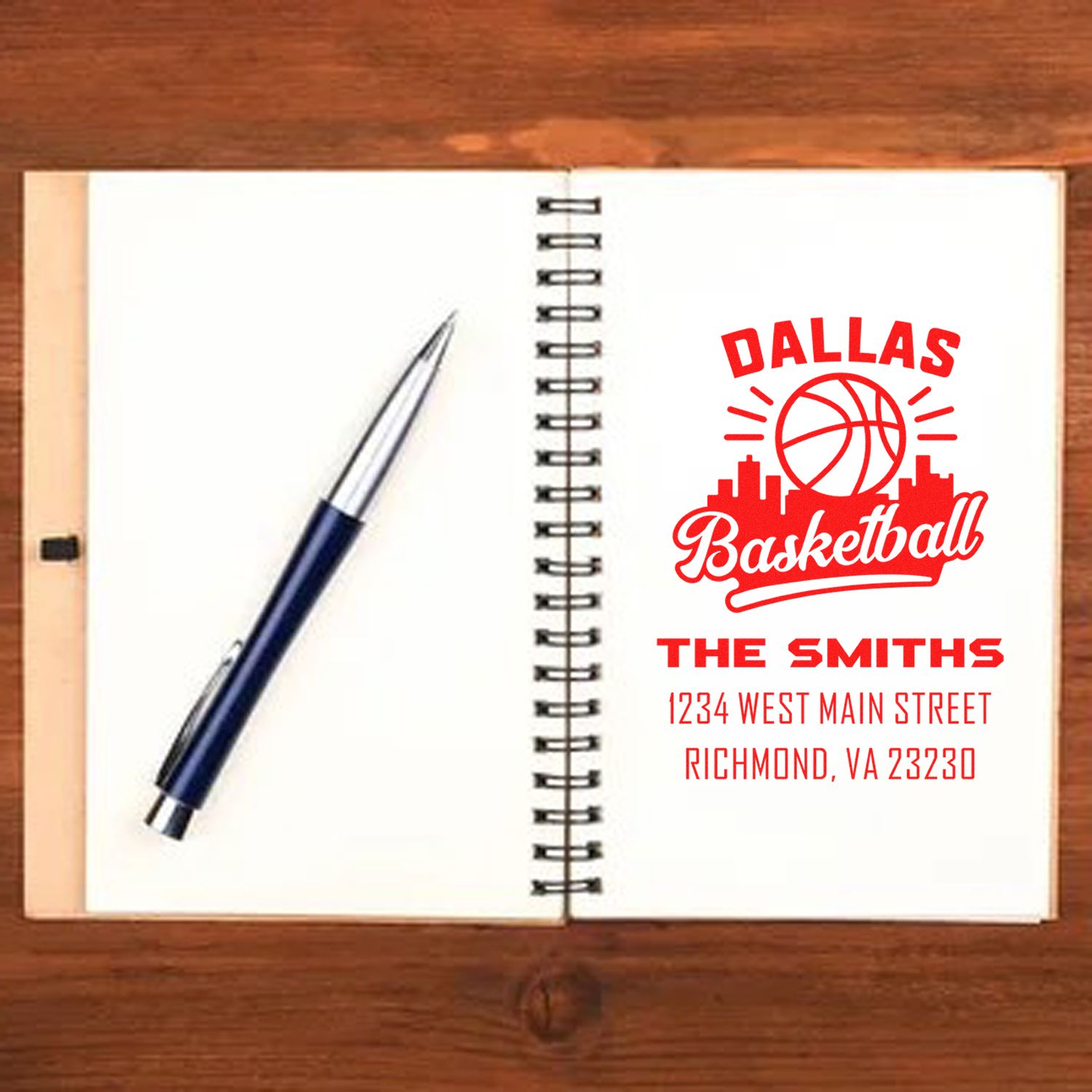 Custom basketball rubber stamp mockup with Dallas design, family name, and address for personalized sports stationery.