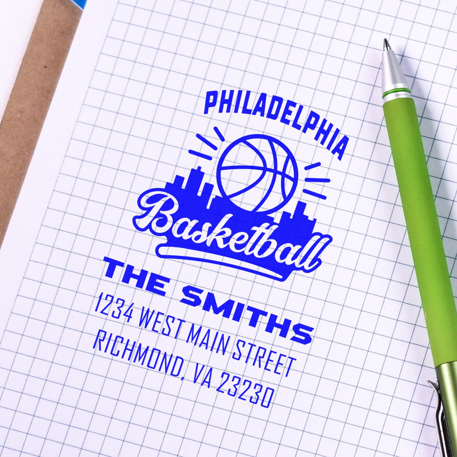 Custom rubber stamp sample for Philadelphia basketball branding, featuring logo and return address.