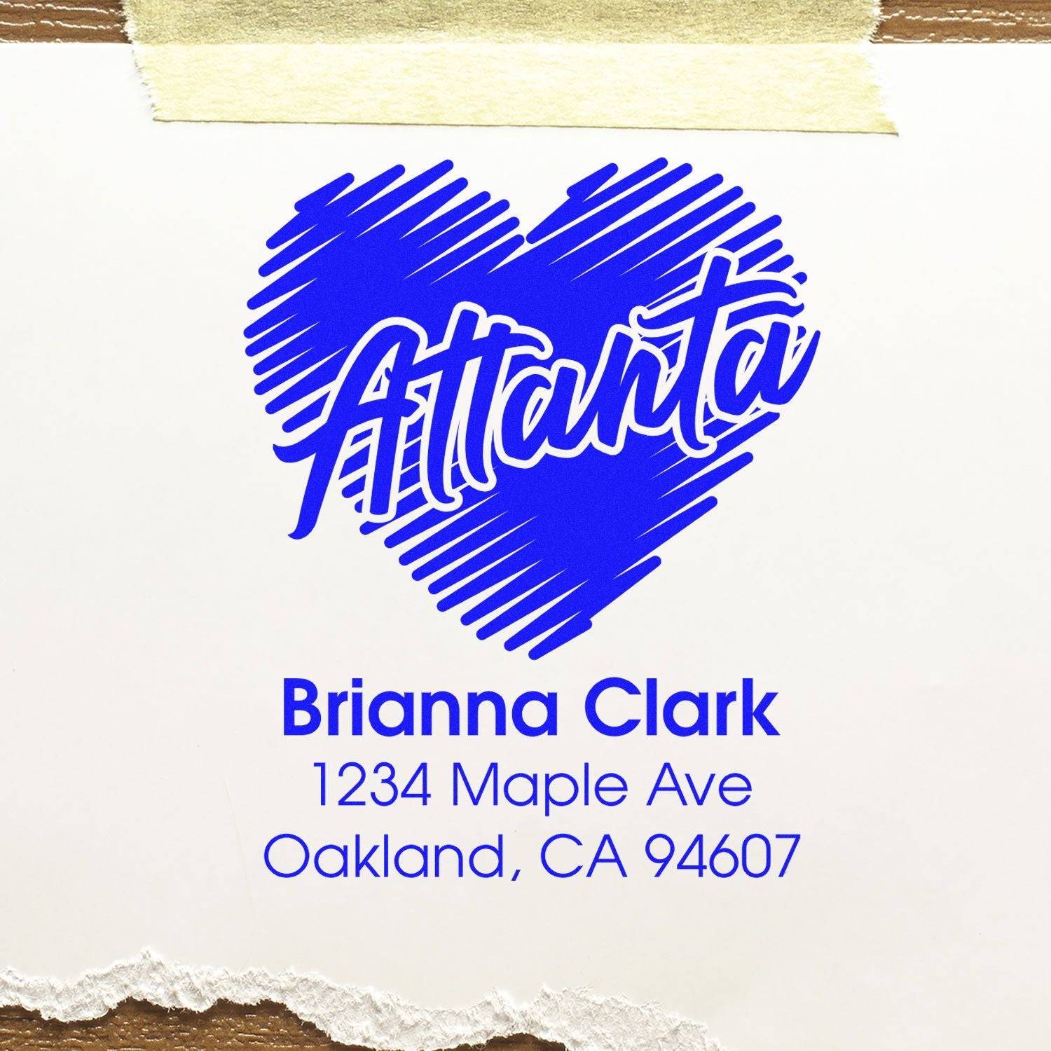 Custom Atlanta heart return address rubber stamp with Brianna Clark name and Oakland, CA address in blue.