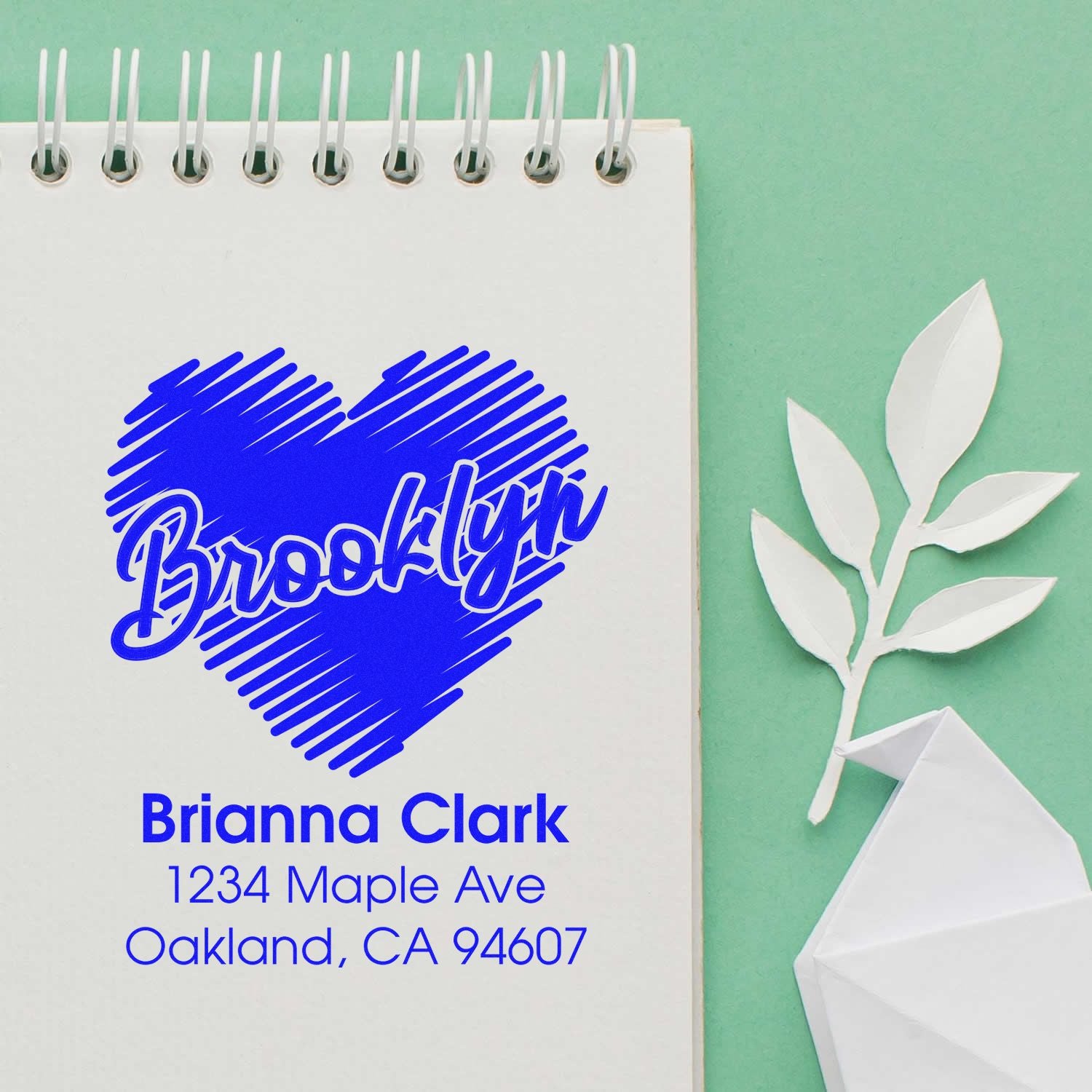 Custom rubber stamp with Brooklyn heart design, name, and address for personalized stationery and return mail.