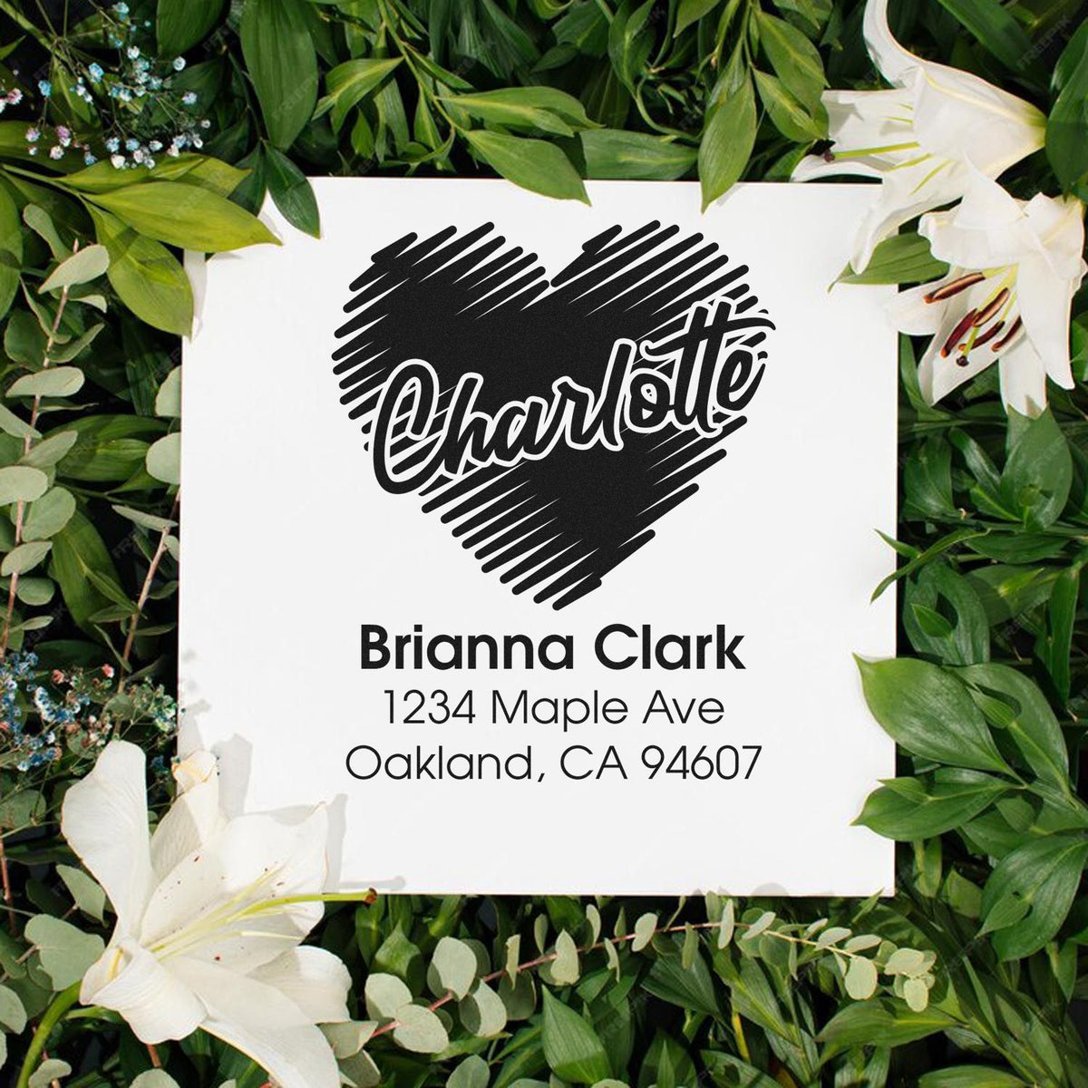 Personalized address rubber stamp with heart design for custom return address labels and wedding stationery.