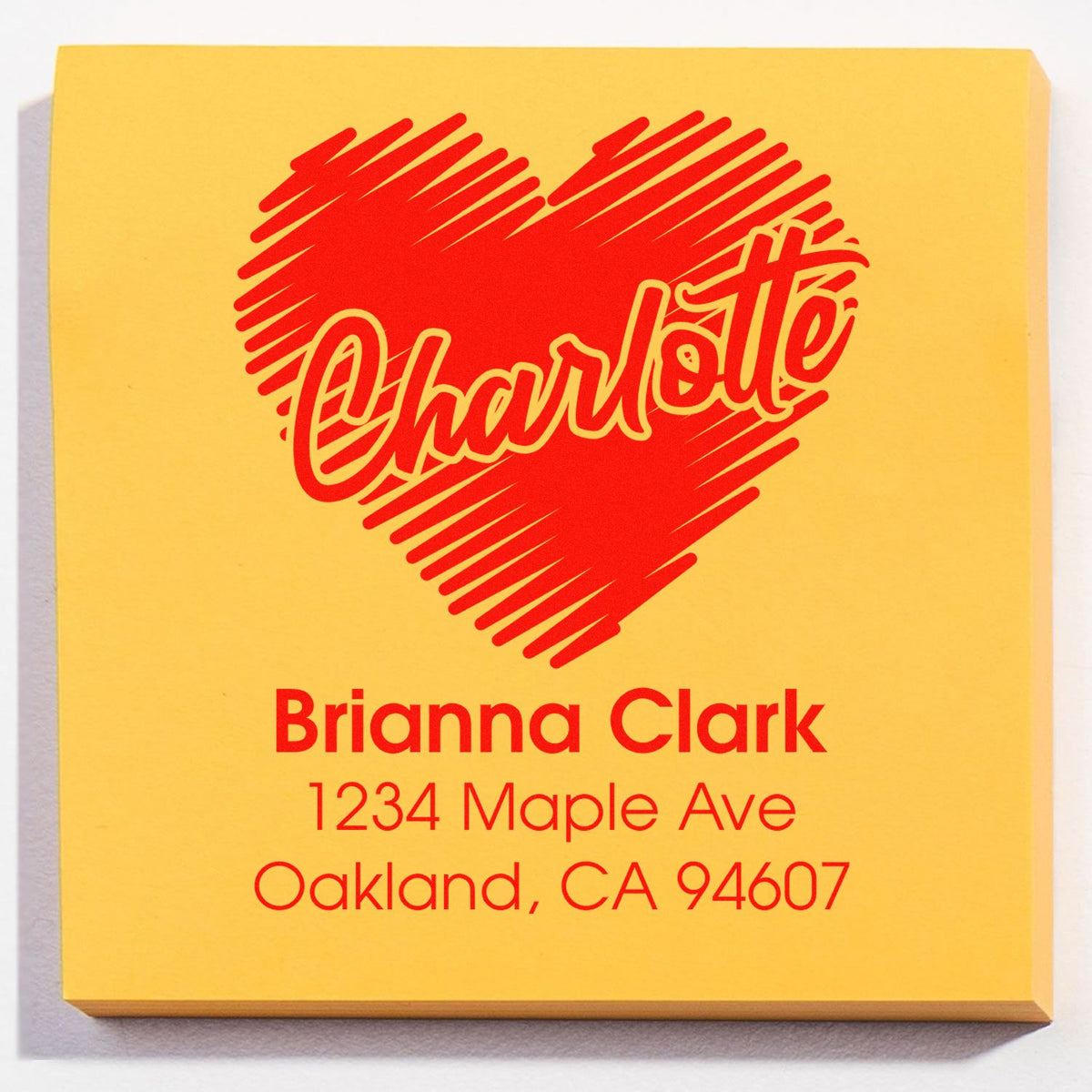 Custom rubber stamp with heart design and personalized return address for Brianna Clark, Oakland, CA.