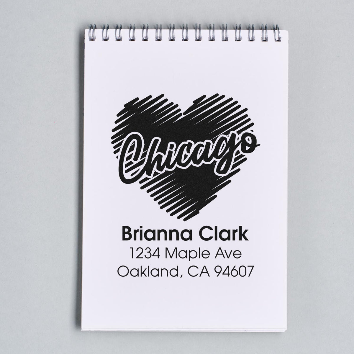 Custom address rubber stamp with Chicago heart design for Brianna Clark, Oakland, CA 94607.