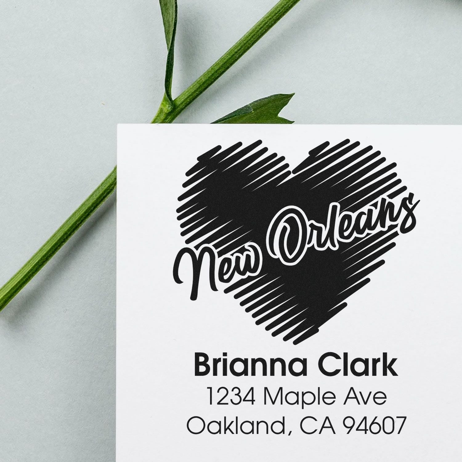 Custom New Orleans address rubber stamp with heart design for Brianna Clark, featuring personalized name and mailing address.