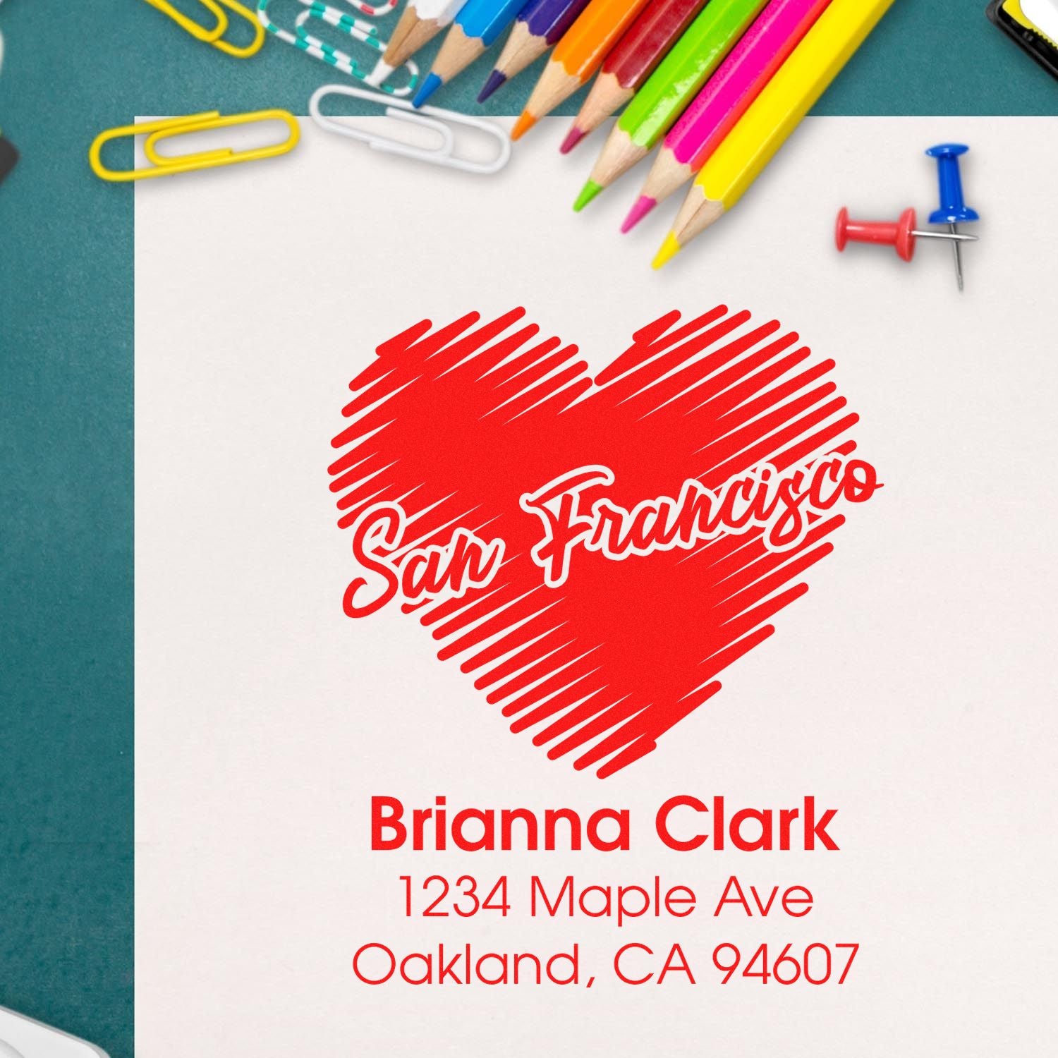 Custom rubber stamp mockup with San Francisco heart and Brianna Clark address for personalized stationery and mailing.