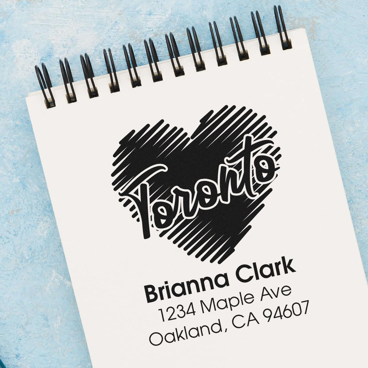 Custom return address rubber stamp with heart design for Brianna Clark, ideal for stationery and mailing.