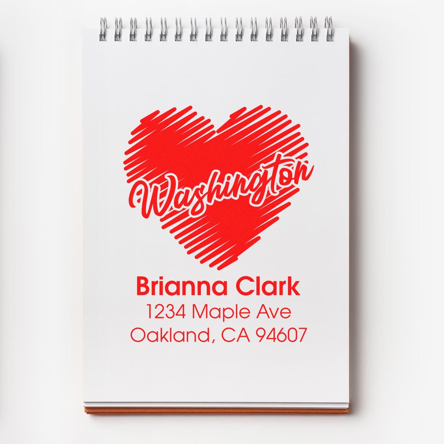 Custom Washington heart rubber stamp with personalized return address for Brianna Clark, Oakland, CA 94607.