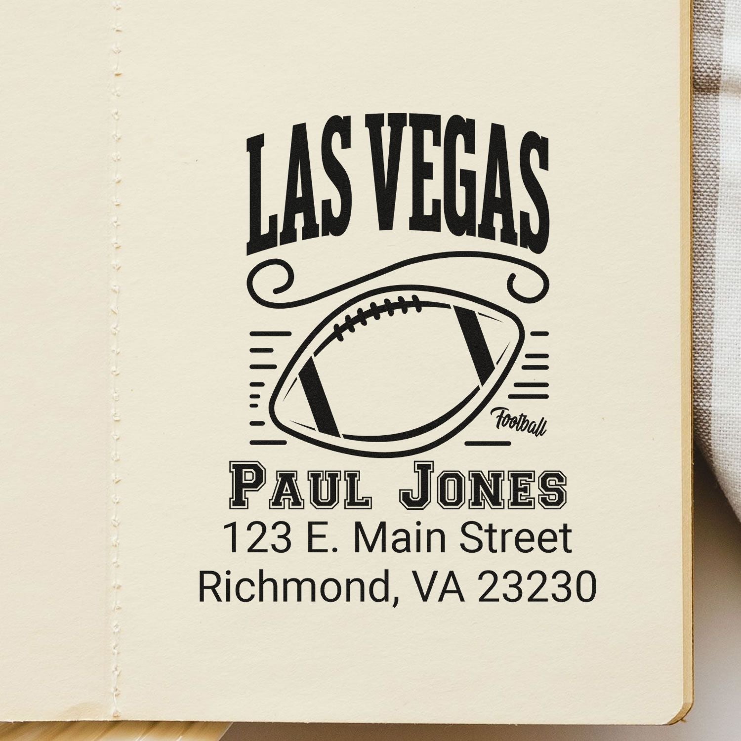 Custom Las Vegas football address rubber stamp with Paul Jones, 123 E. Main Street, Richmond, VA 23230.