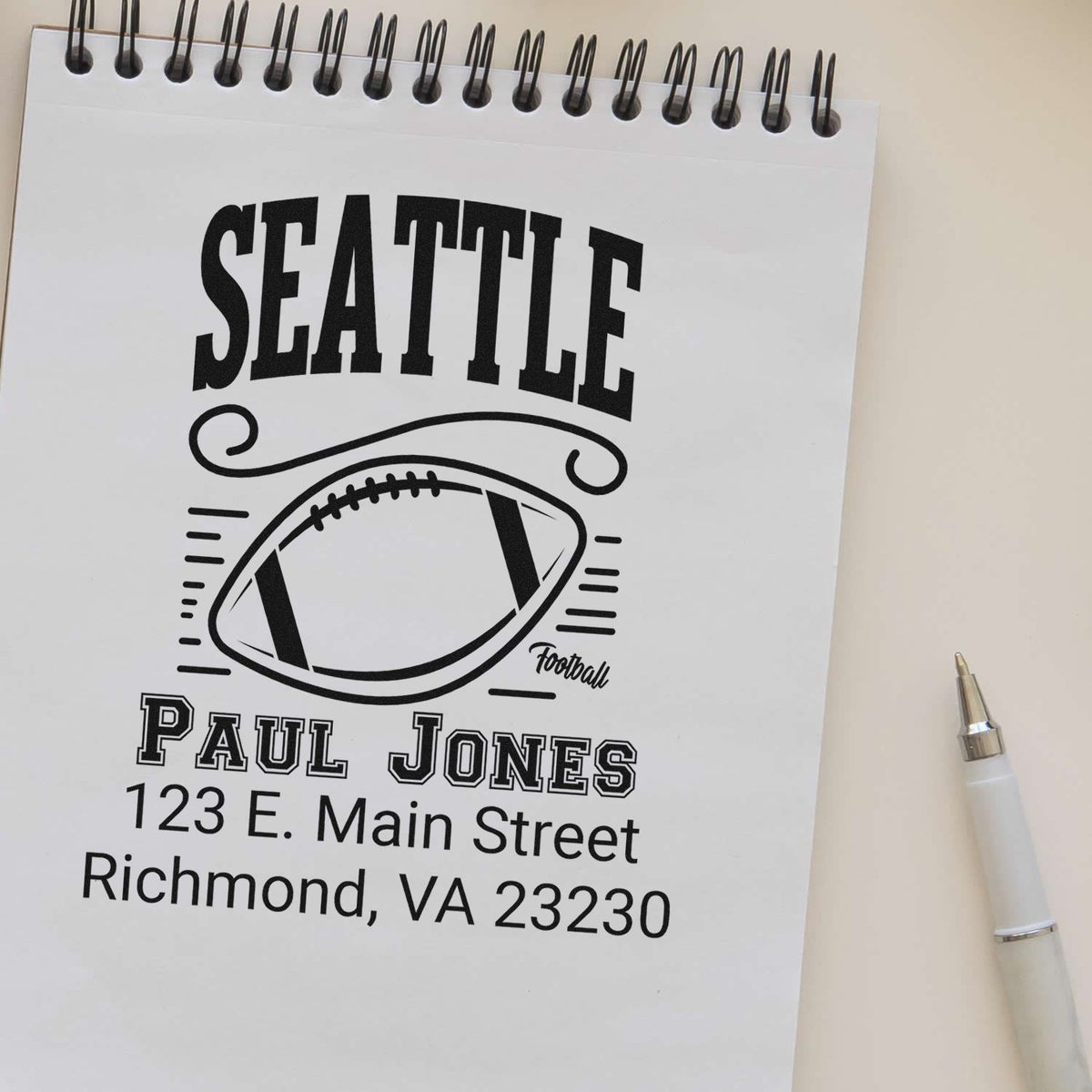Custom Seattle football rubber stamp design with personalized name, address, and team logo for return mail.