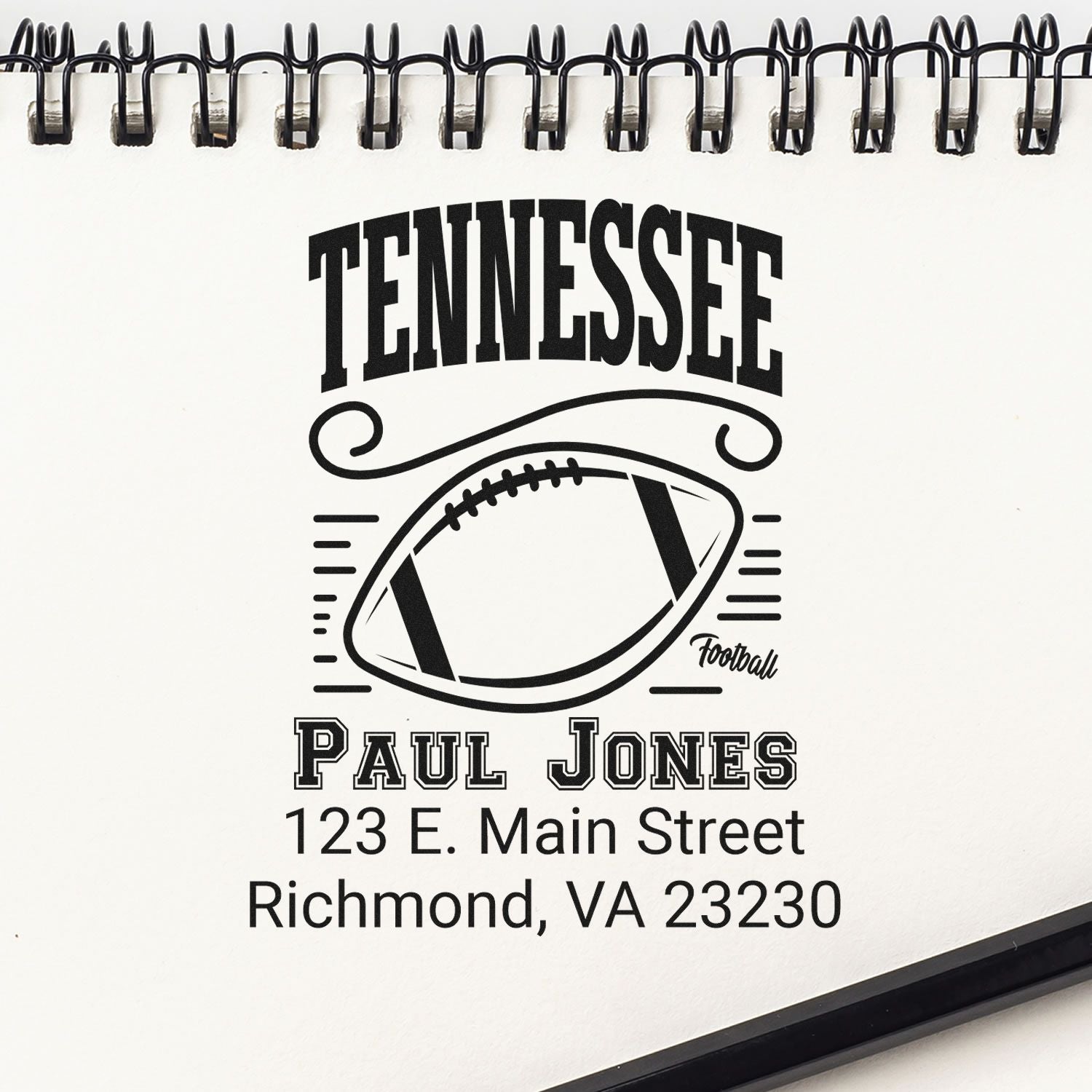 Custom Tennessee football rubber stamp design with name, address, and football graphic for Paul Jones.