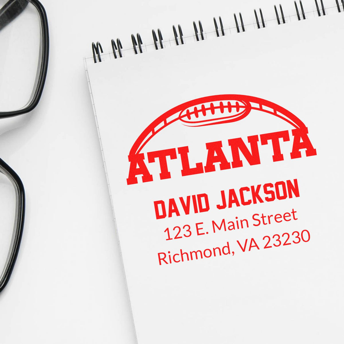 Custom Atlanta rubber stamp with football logo, name, and address for mailing and branding