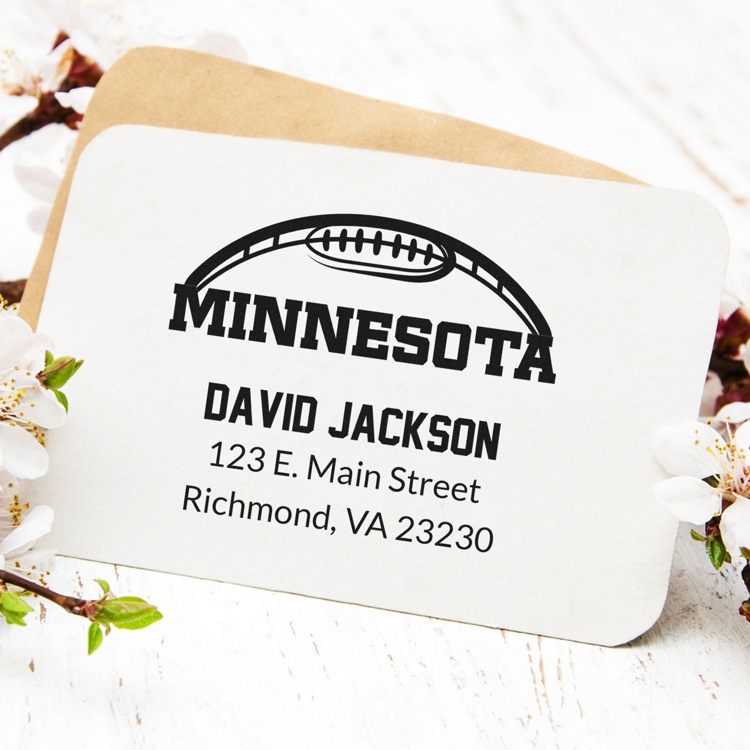 Custom Minnesota football rubber stamp with name and address, ideal for personalized return address envelopes and sports stationery.