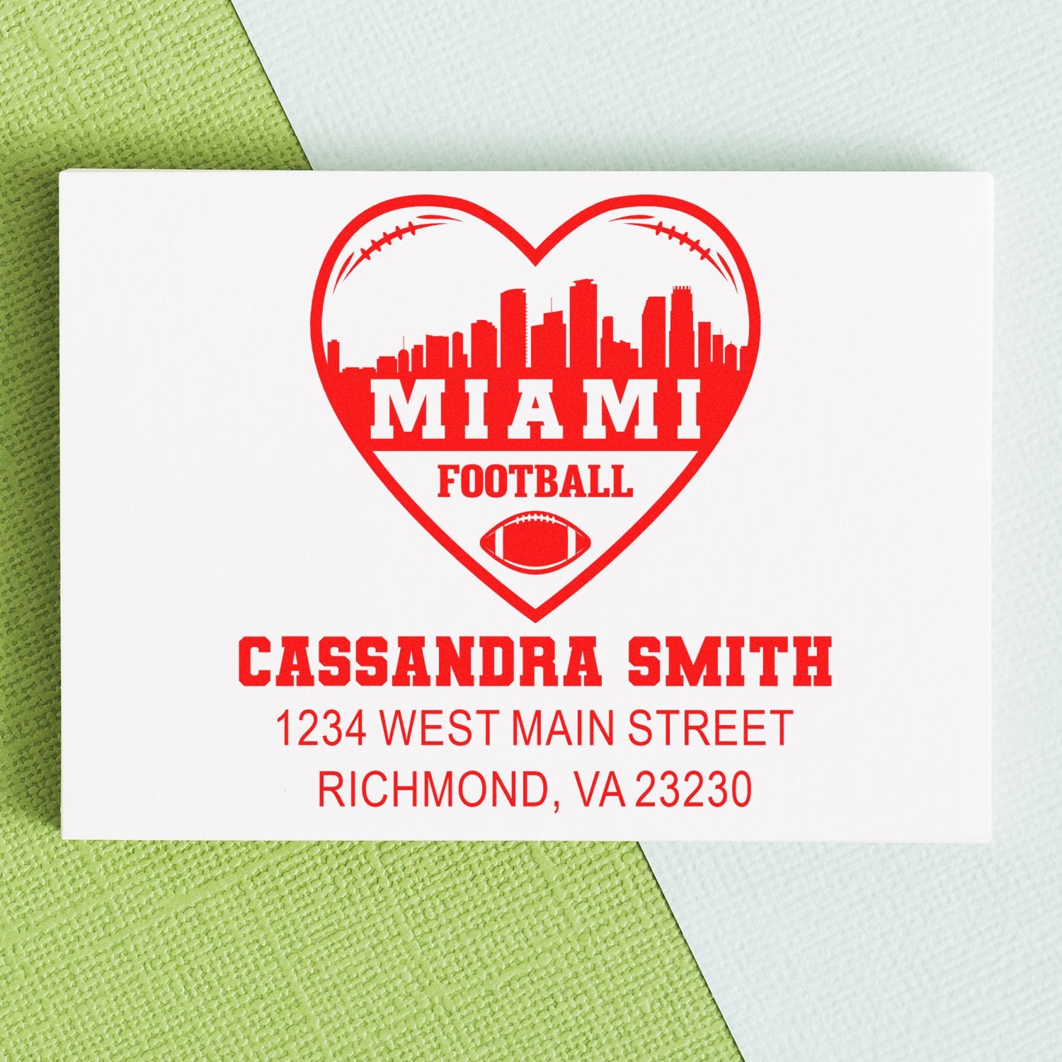 Custom Miami football address stamp with heart skyline design for Cassandra Smith, Richmond, VA.