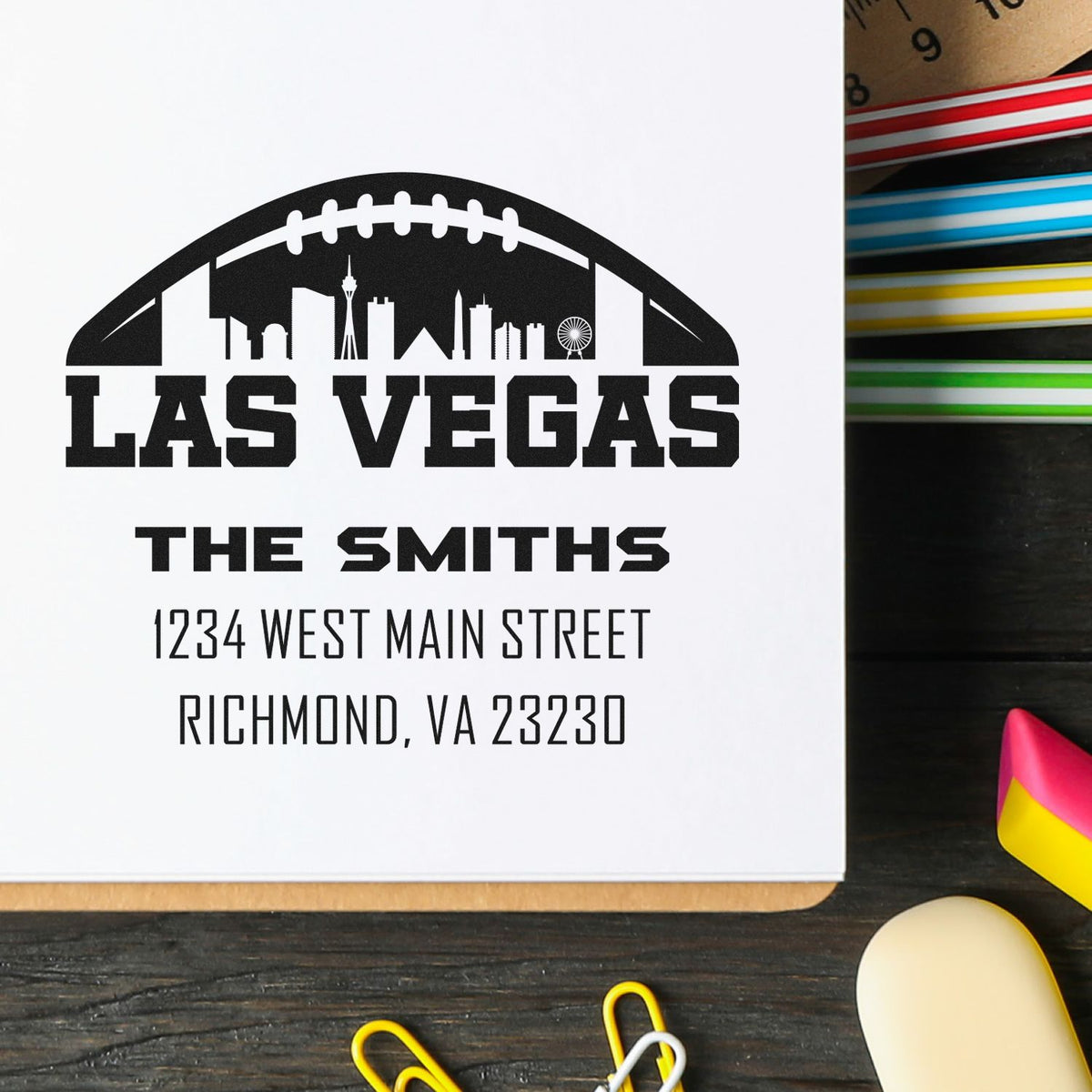 Custom return address rubber stamp with Las Vegas skyline and The Smiths family name for personalized mailing.