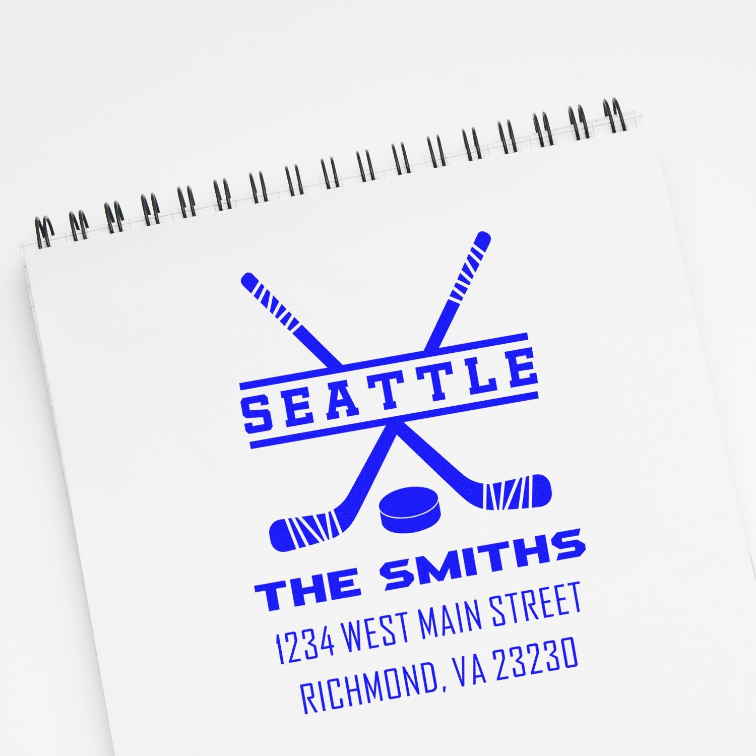 Custom hockey rubber stamp on notebook for Seattle The Smiths with crossed sticks and Richmond, VA address.