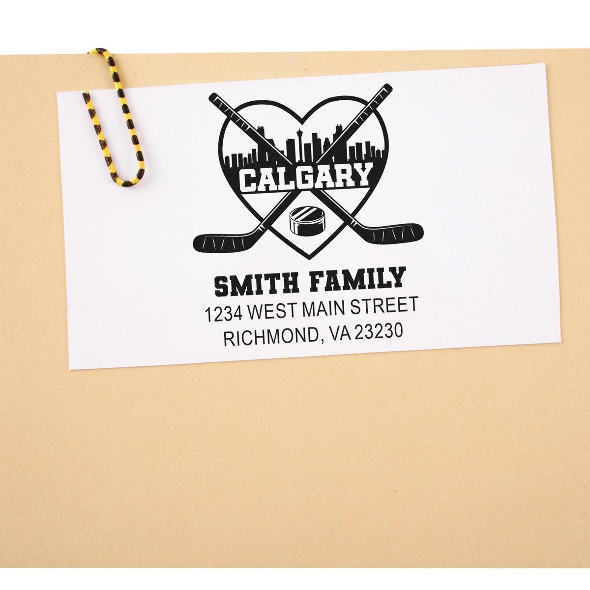 Personalized hockey return address rubber stamp with Calgary skyline, Smith family name, and mailing address.