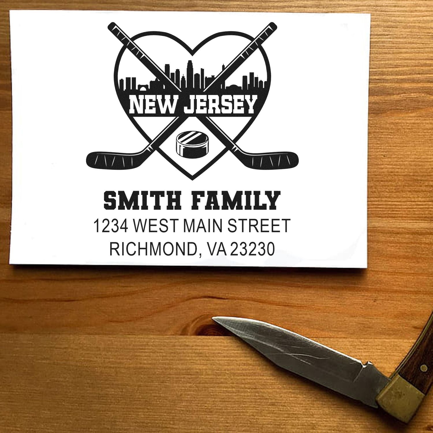 Personalized hockey return address rubber stamp with New Jersey skyline, crossed sticks, and Smith family name and address.
