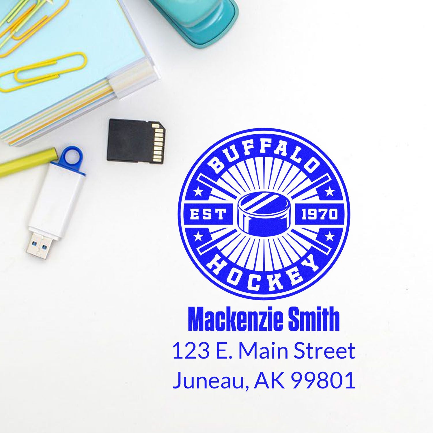 Custom Buffalo Hockey address rubber stamp with logo, name, and Juneau, AK mailing details for personalized branding.