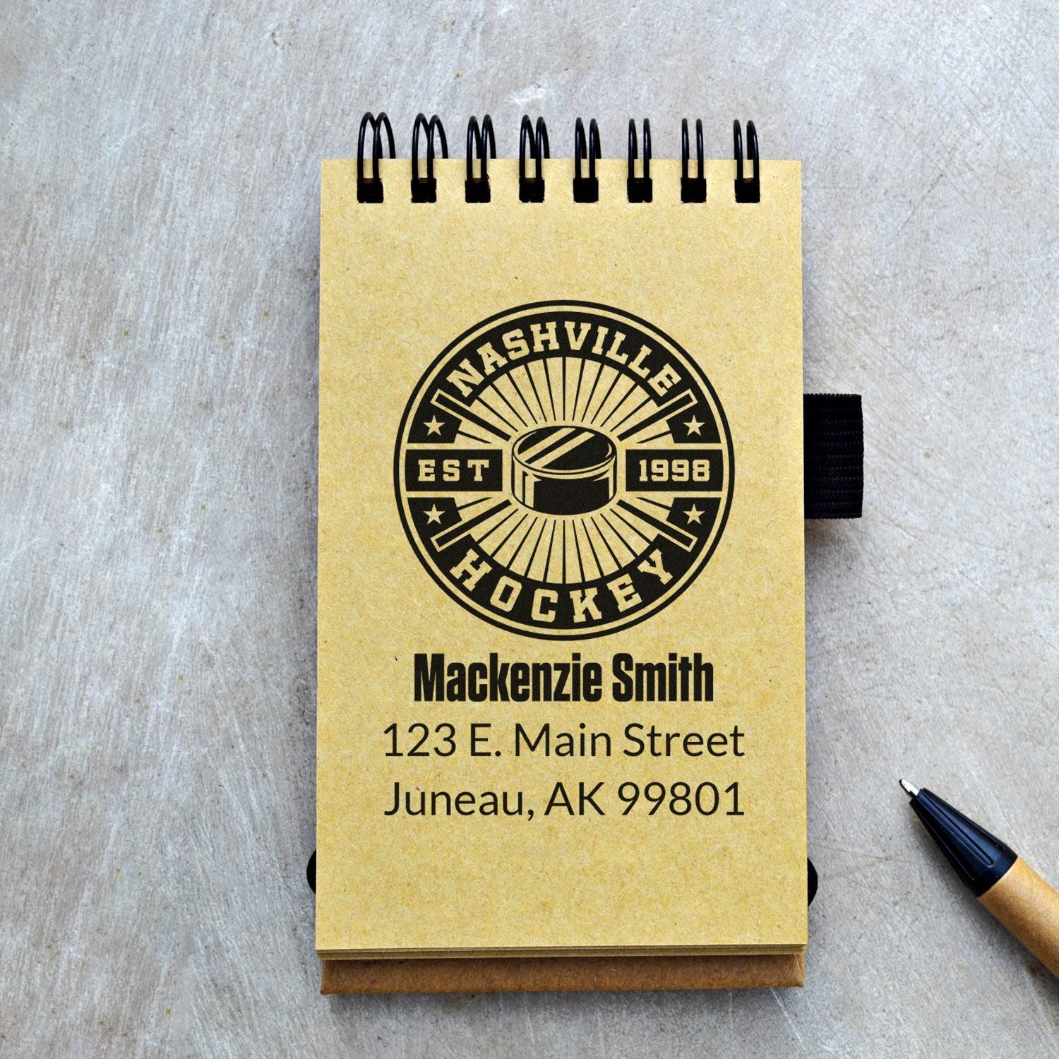 Custom Nashville Hockey rubber stamp design on a notepad with name and address, ideal for personalized stationery.