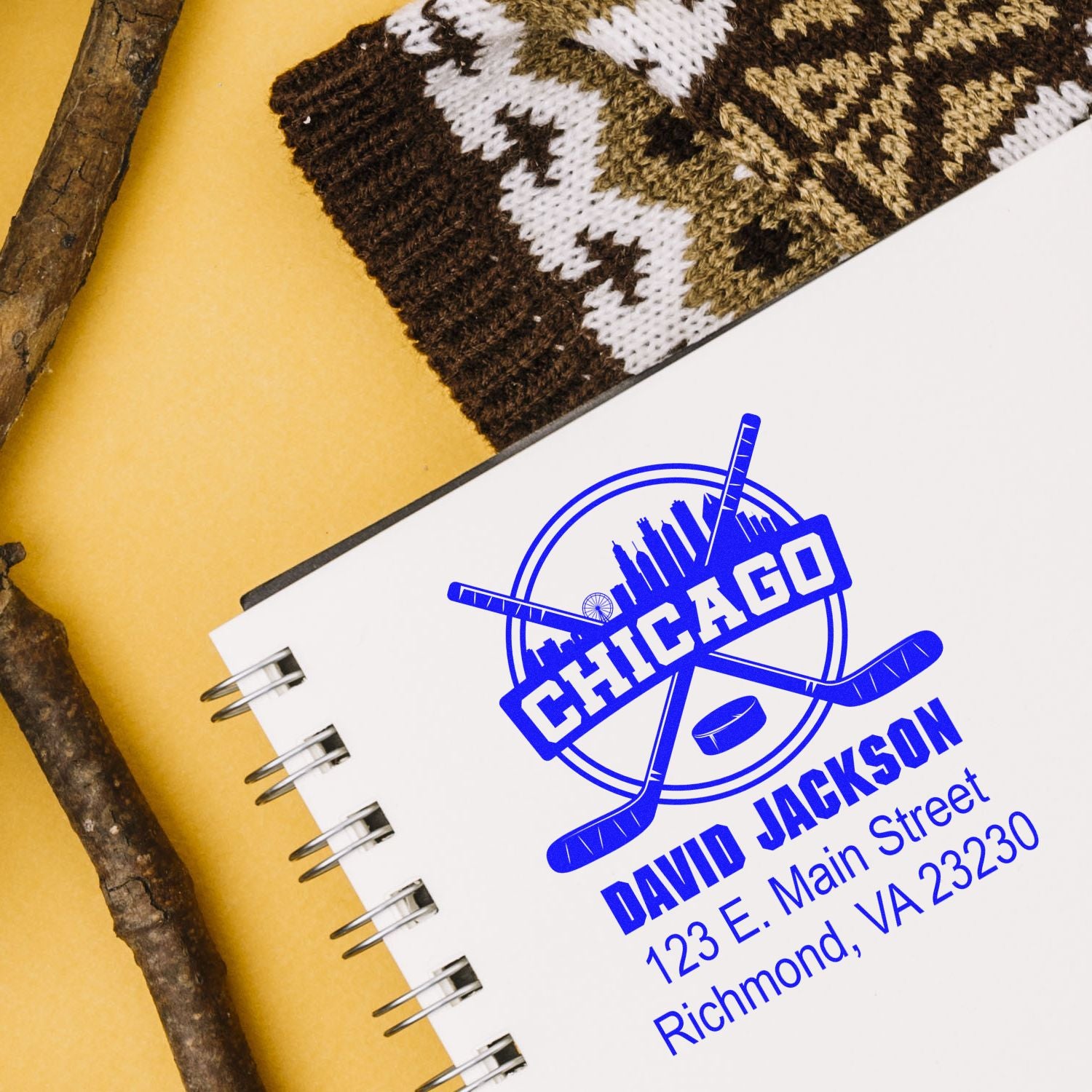 Custom Chicago hockey rubber stamp with David Jackson name, address, and sports logo on a spiral notebook.