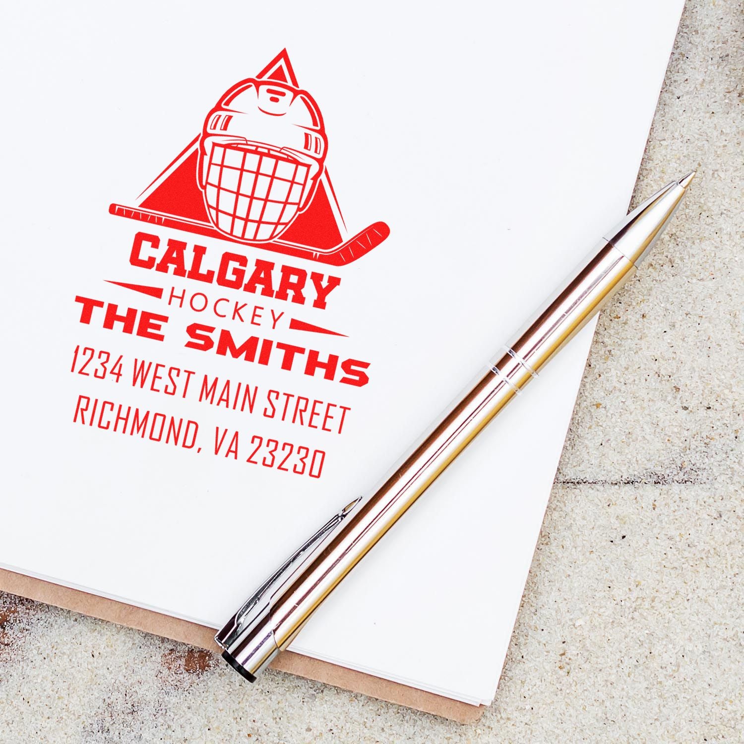 Custom hockey address rubber stamp with Calgary goalie logo for The Smiths, featuring name and street address.