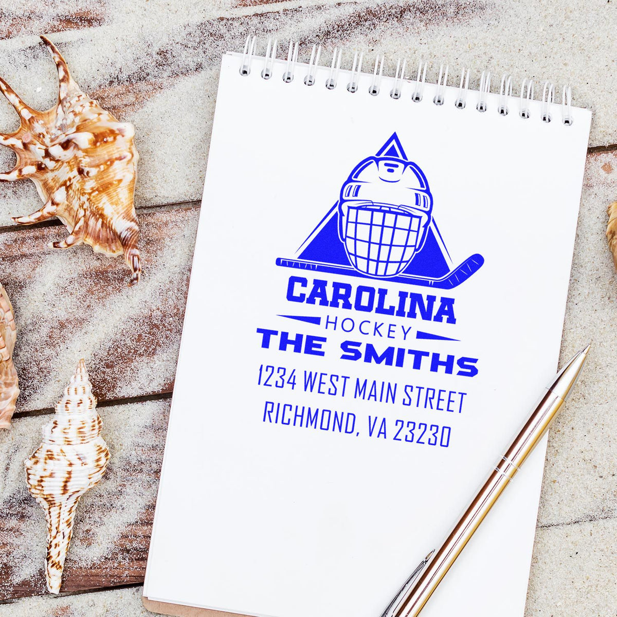 Personalized Carolina Hockey rubber stamp with hockey logo, The Smiths, and return address on a notebook.