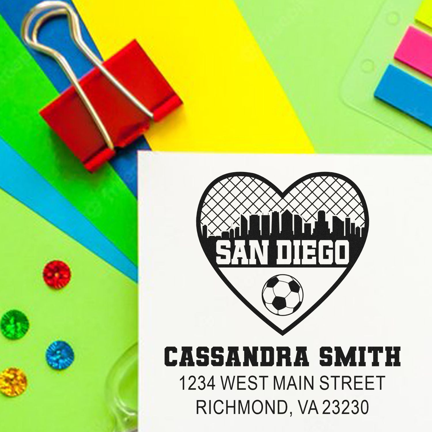 Personalized rubber stamp with San Diego heart skyline, soccer ball, name, and address for mailing.