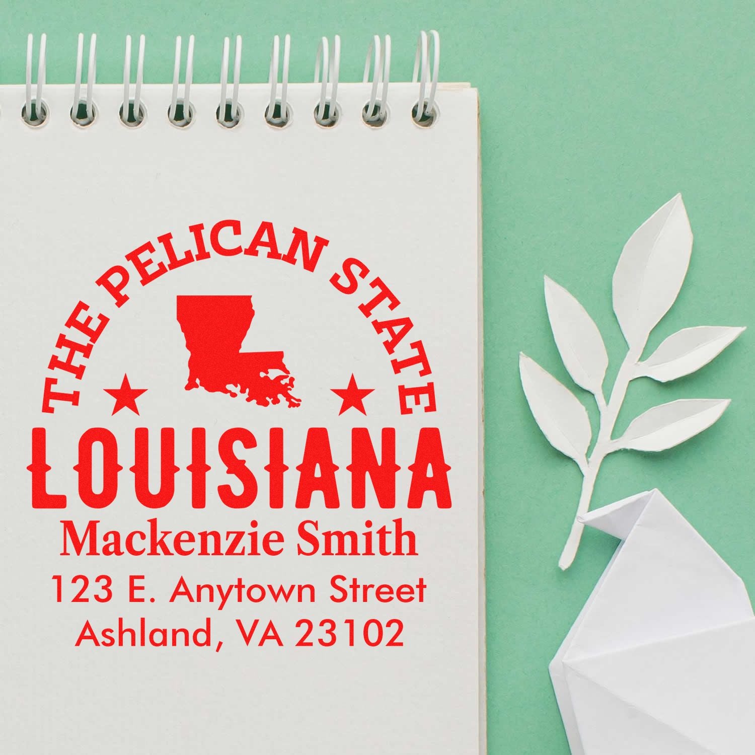 Custom rubber stamp proof for a Louisiana address stamp, featuring The Pelican State, personalized name, and address details.