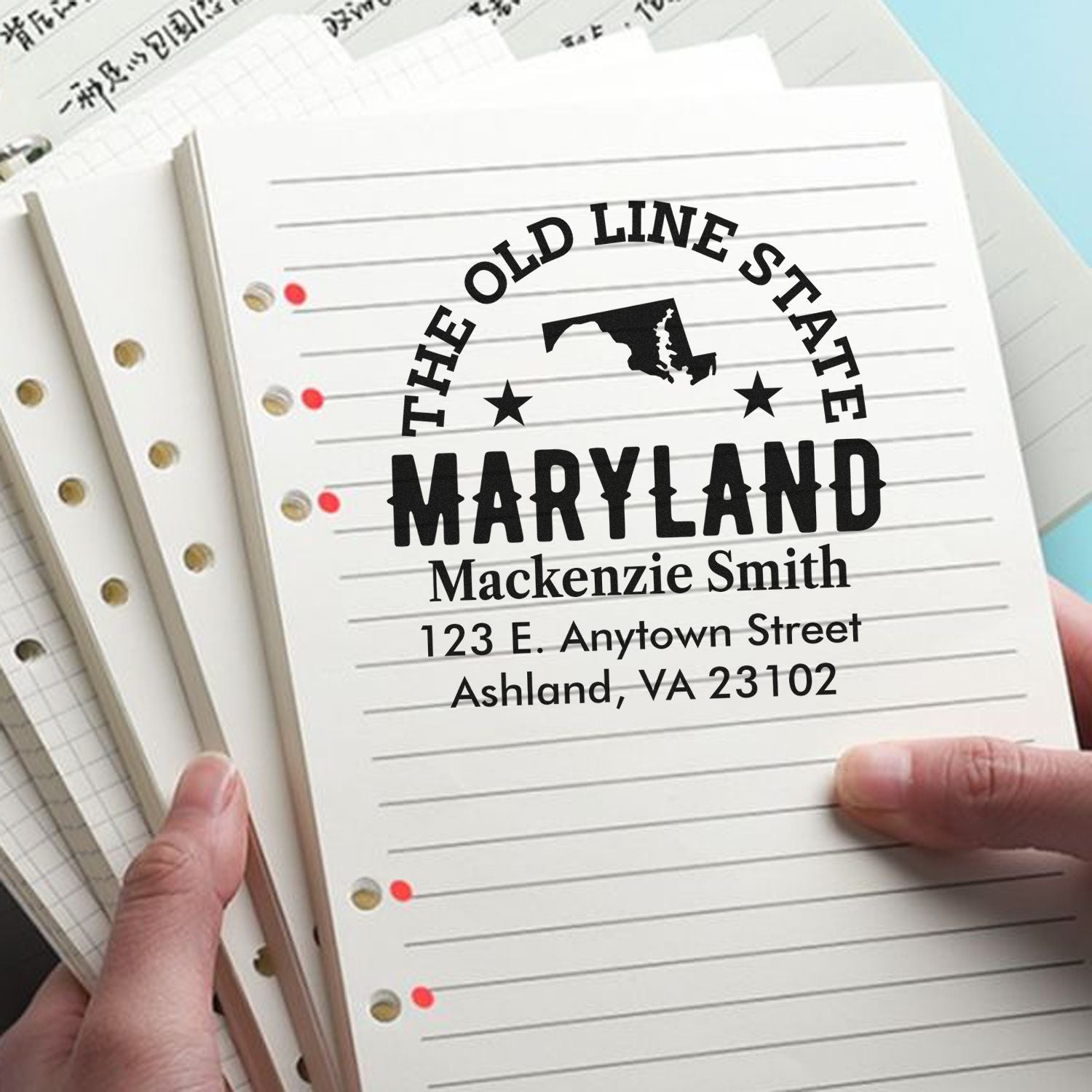 Custom Maryland rubber address stamp with Old Line State design, name, and mailing address for school notebooks.