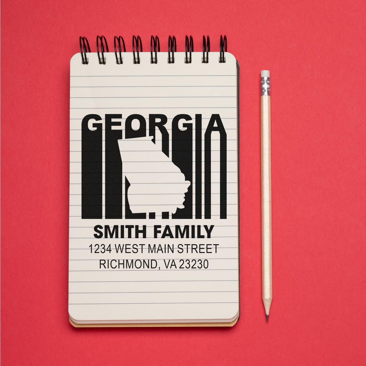 Custom Georgia family address rubber stamp with state outline for personalized mail and stationery.