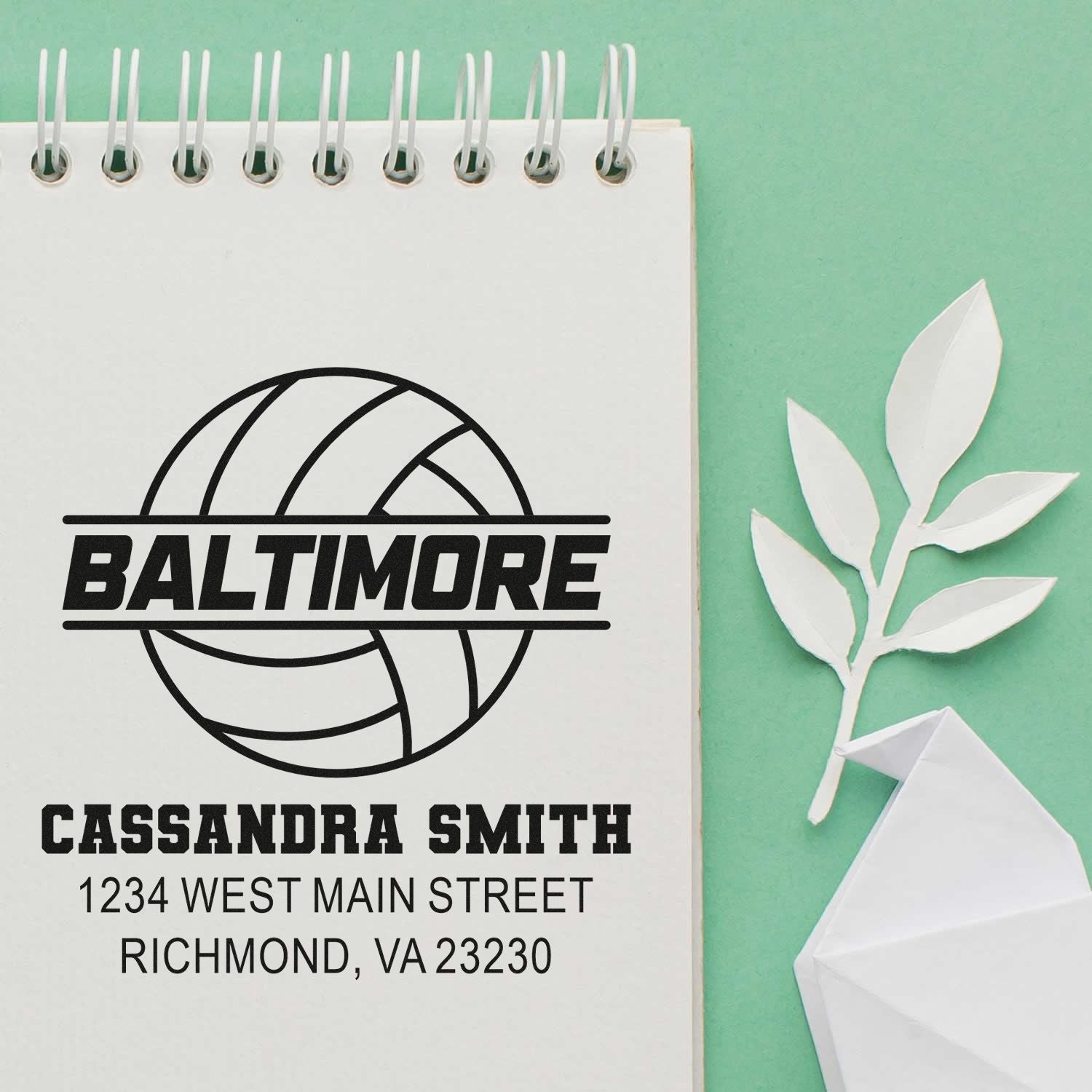Custom rubber stamp mockup with Baltimore volleyball logo, Cassandra Smith name, and Richmond, VA address.