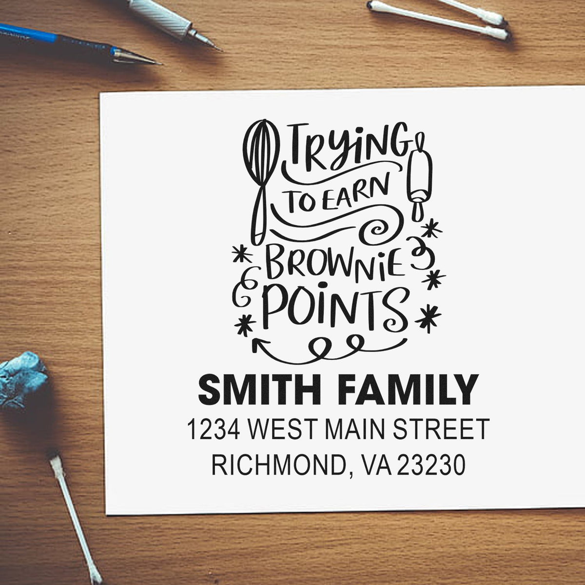 Custom rubber stamp design reading Trying to Earn Brownie Points with Smith family name and return address.