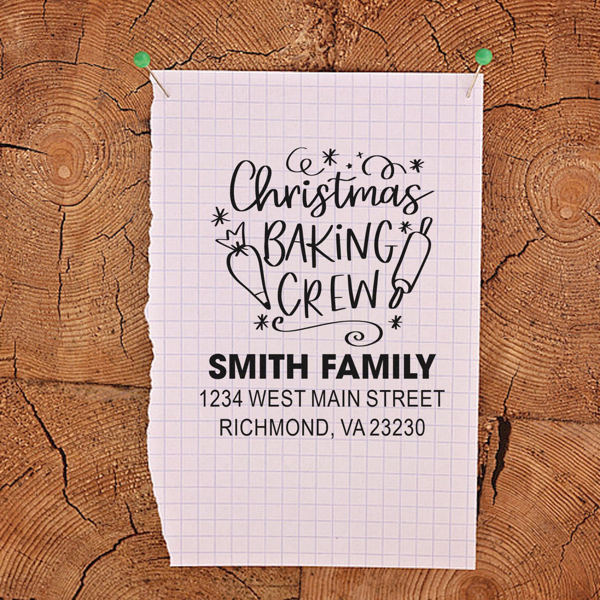 Custom Christmas Baking Crew rubber stamp with family name and address, shown as a personalized holiday address stamp mockup