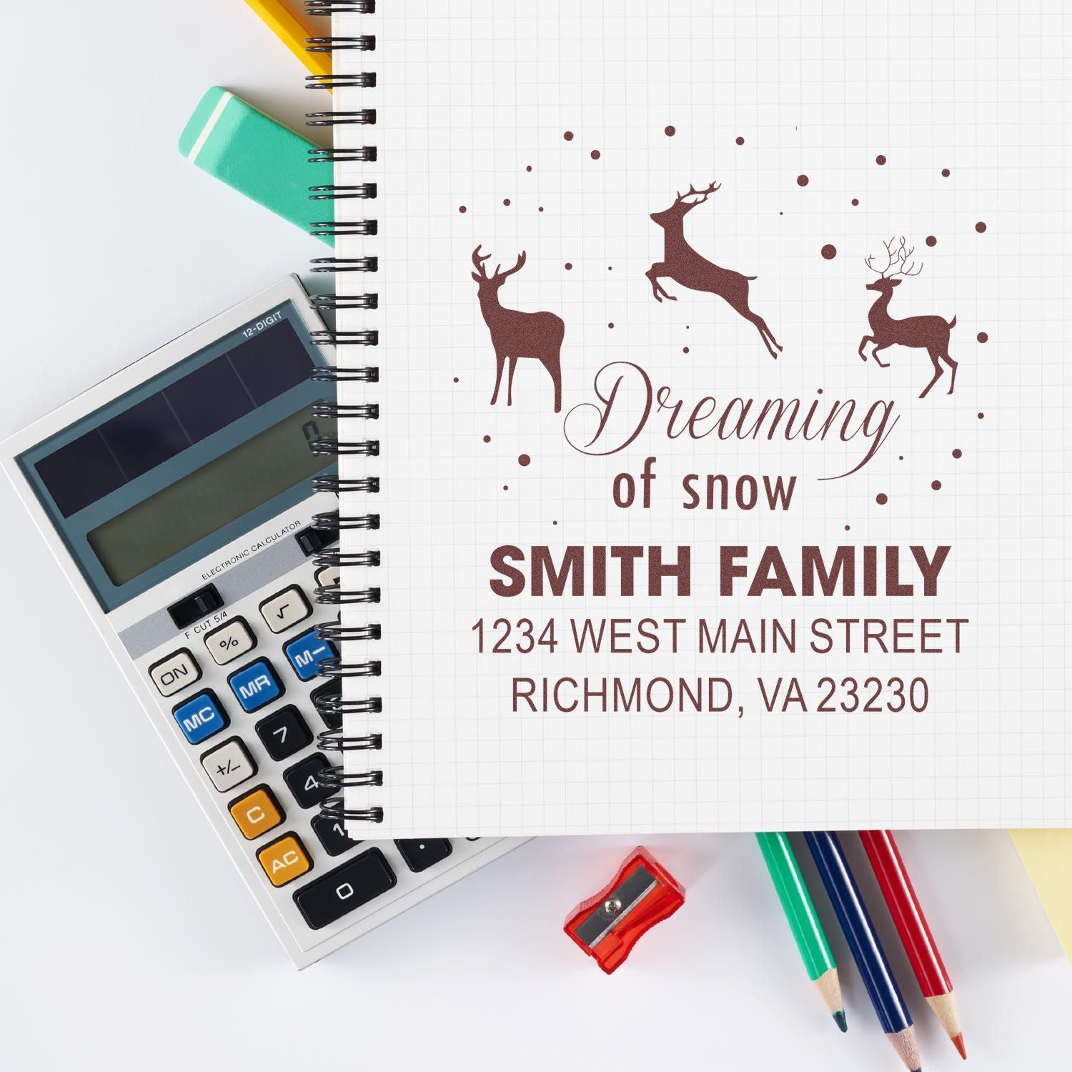 Custom rubber stamp design for holiday cards, featuring deer and a personalized family address stamp.