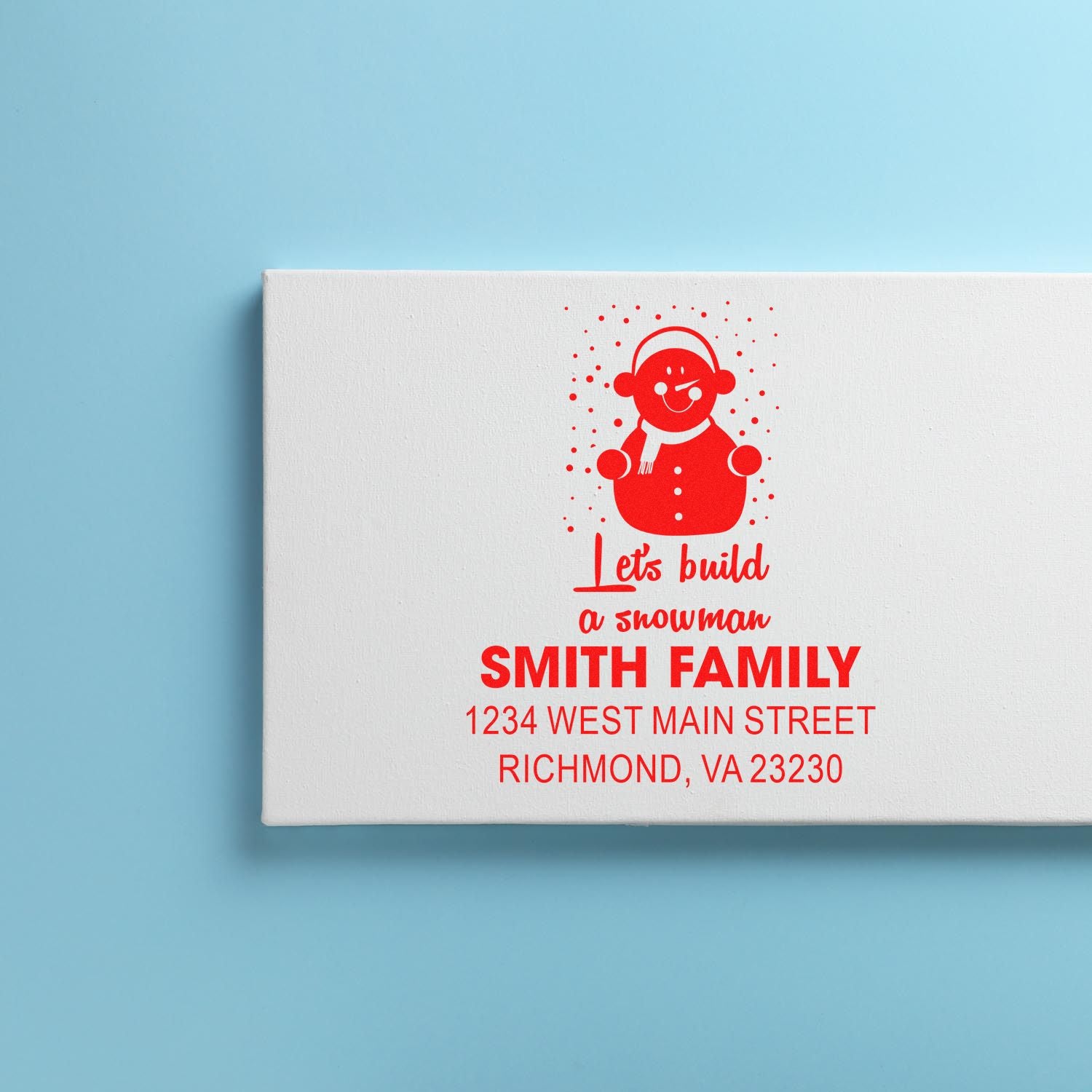 Personalized family holiday rubber stamp with snowman design and return address for Smith Family, Richmond, VA 23230.