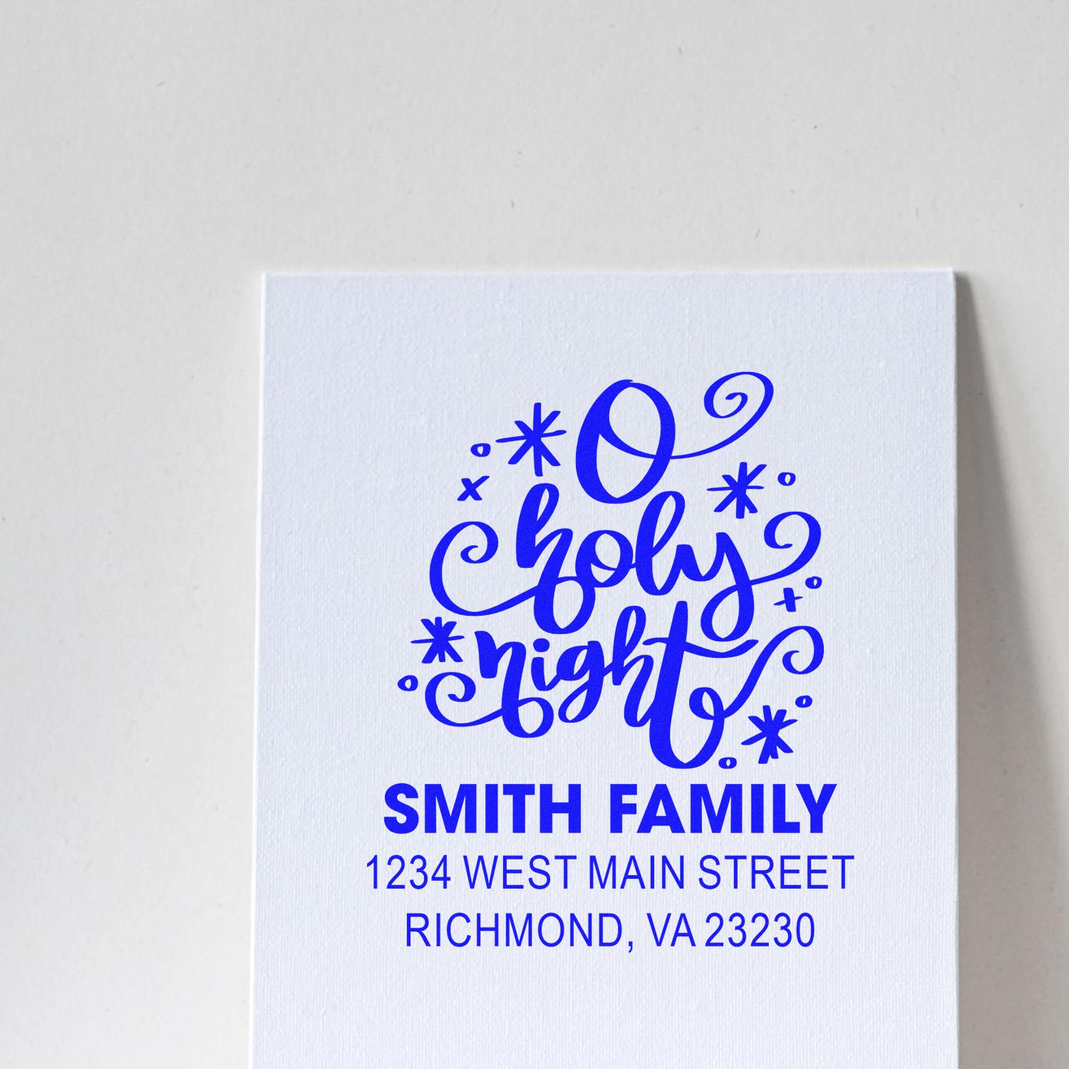 Custom rubber stamp design with O Holy Night holiday lettering and Smith Family return address for Christmas cards.
