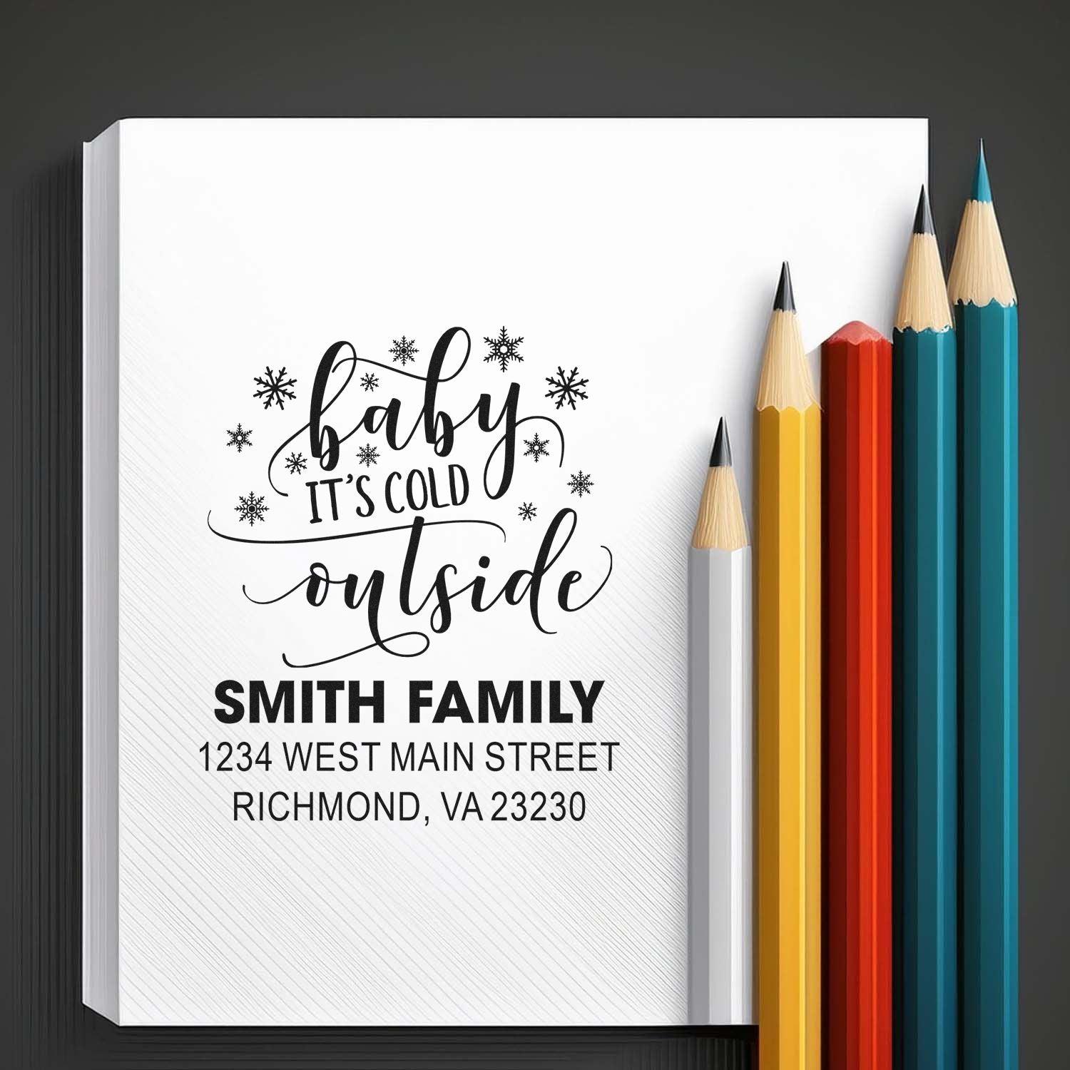 Custom rubber stamp with Baby Its Cold Outside and family address for personalized winter holiday mailing.