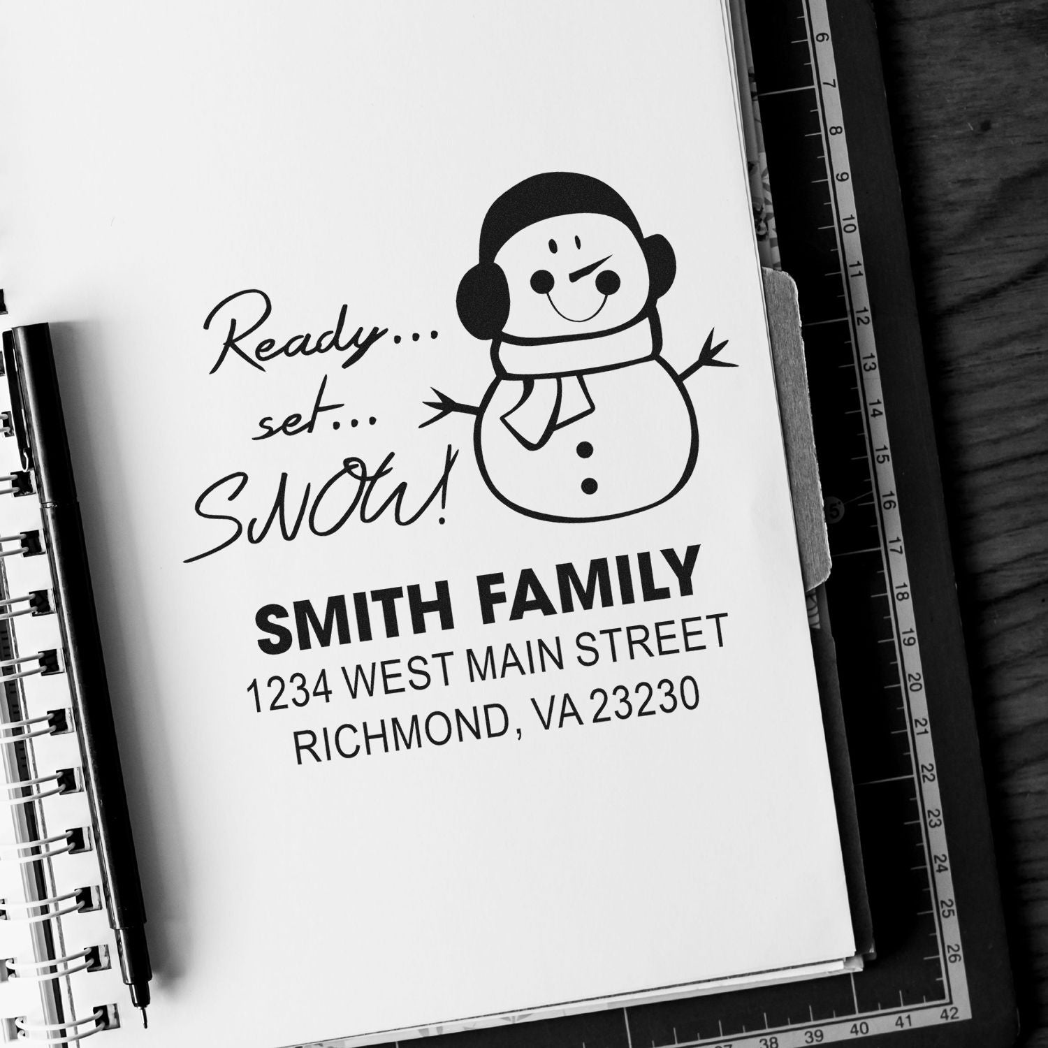 Custom rubber stamp with snowman design, Ready... set... SNOW! and Smith family address for holiday mailings.