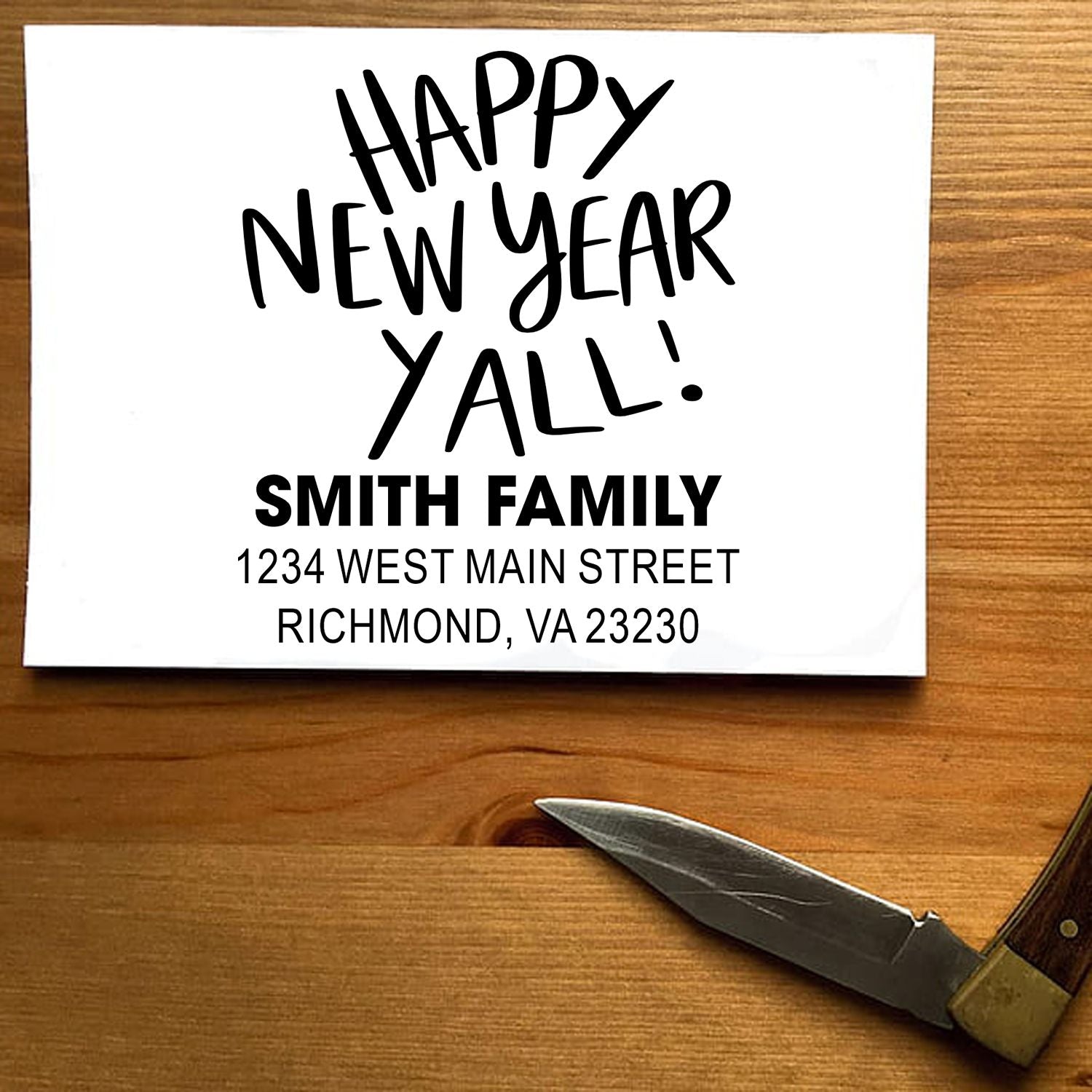 Custom Happy New Year rubber stamp with Smith family return address for holiday cards, envelopes, and packaging.