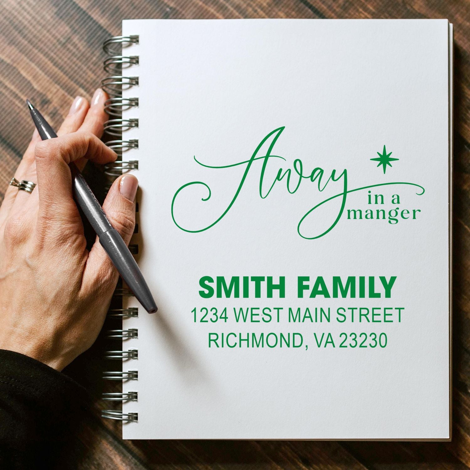 Custom rubber stamp with Away in a Manger design and Smith family address for holiday mailing.
