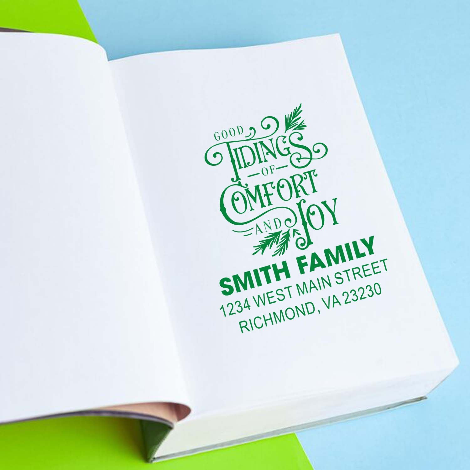 Custom holiday rubber stamp with Good Tidings of Comfort and Joy and Smith family return address for festive mail.
