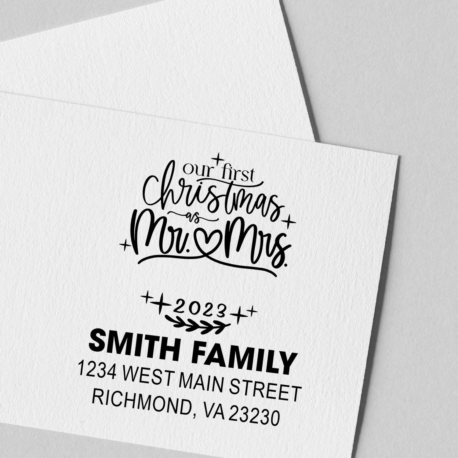 Custom rubber stamp for first Christmas as Mr. & Mrs., with family name, year, and return address for holiday cards.