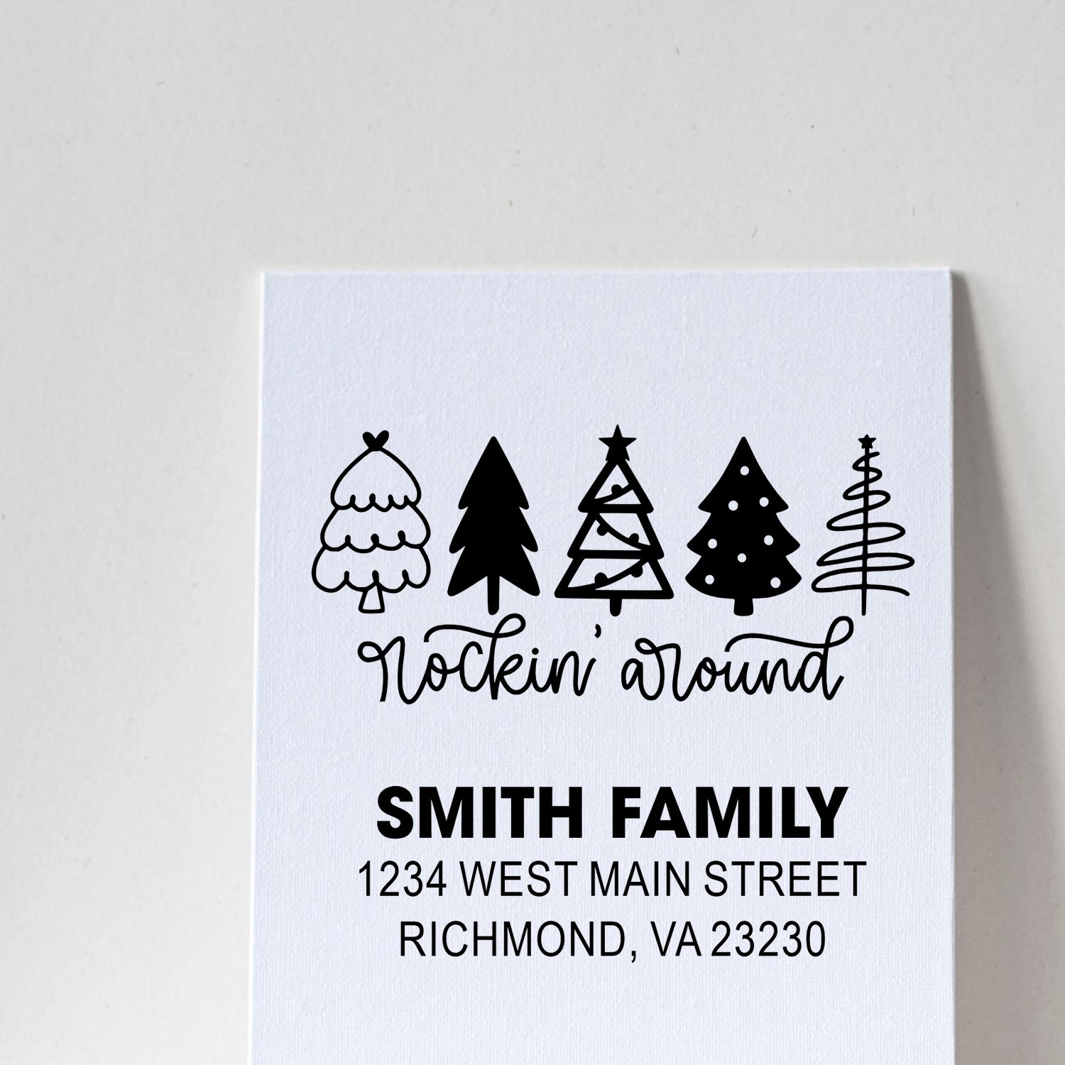 Personalized Christmas return address rubber stamp with Nockin Around tree design and family address.