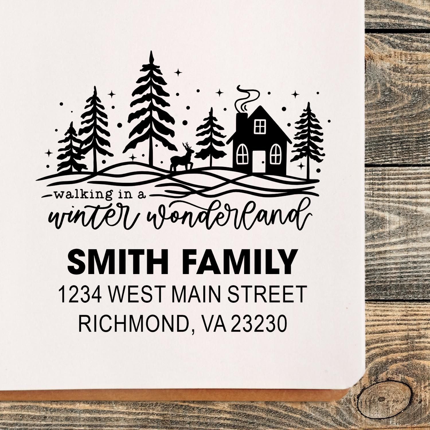 Personalized winter wonderland return address rubber stamp with family name and address for holiday mail.
