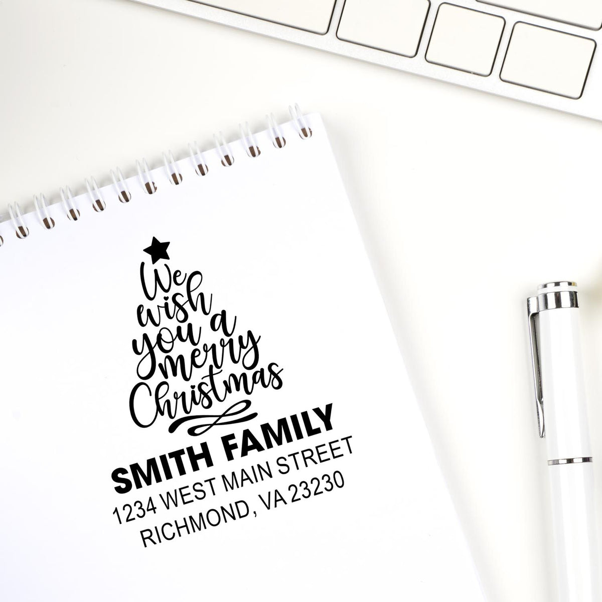 Personalized Christmas return address rubber stamp with family name for holiday cards and envelopes.